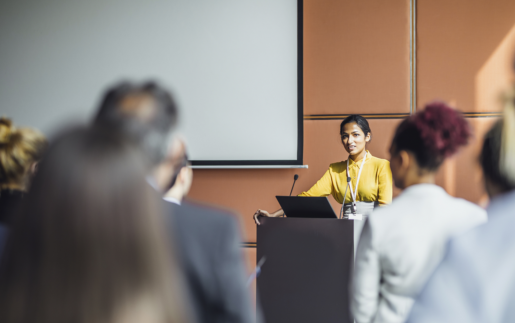 business people at a conference listening to the speaker