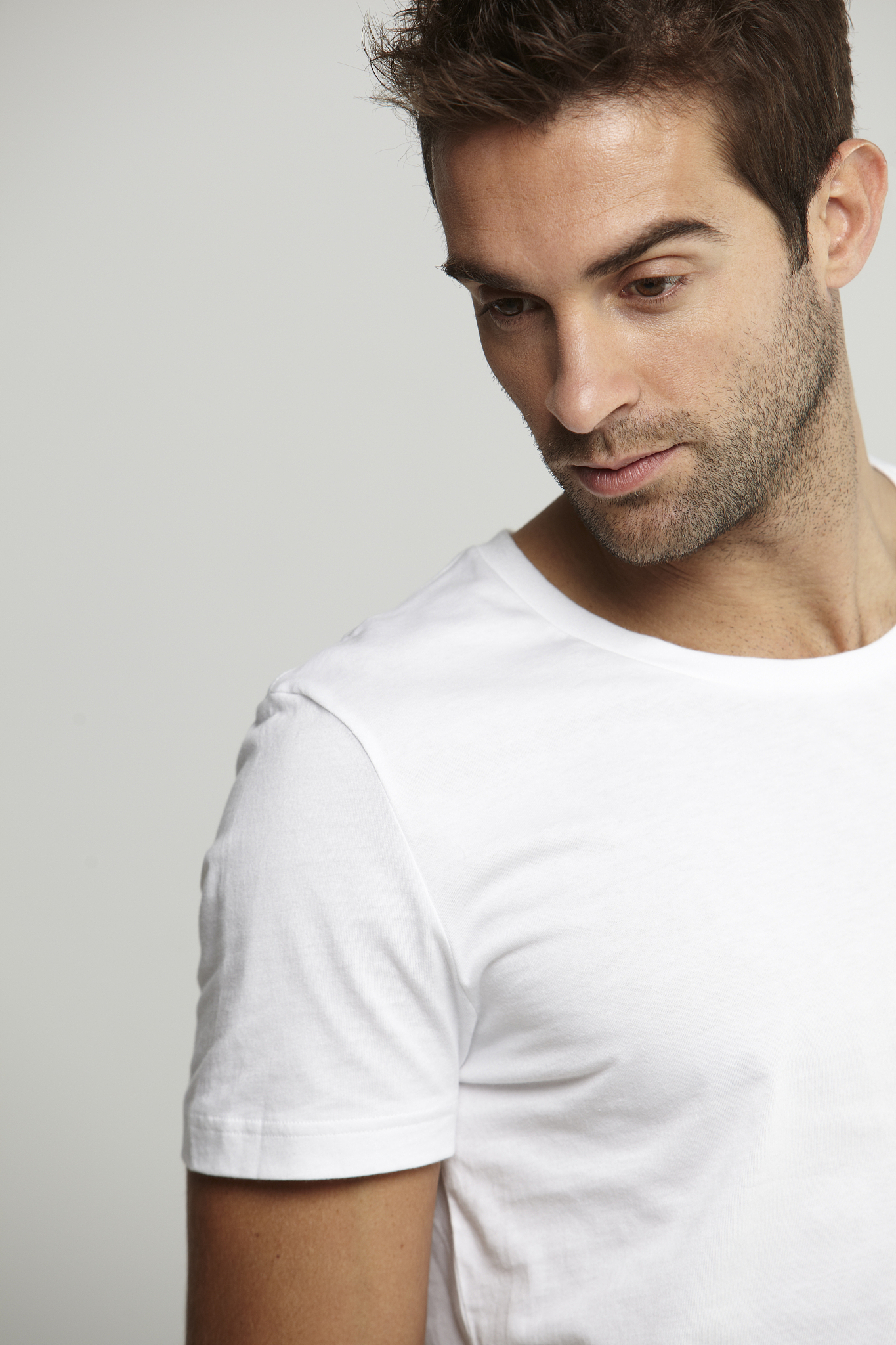 mid adult man in white t-shirt, studio