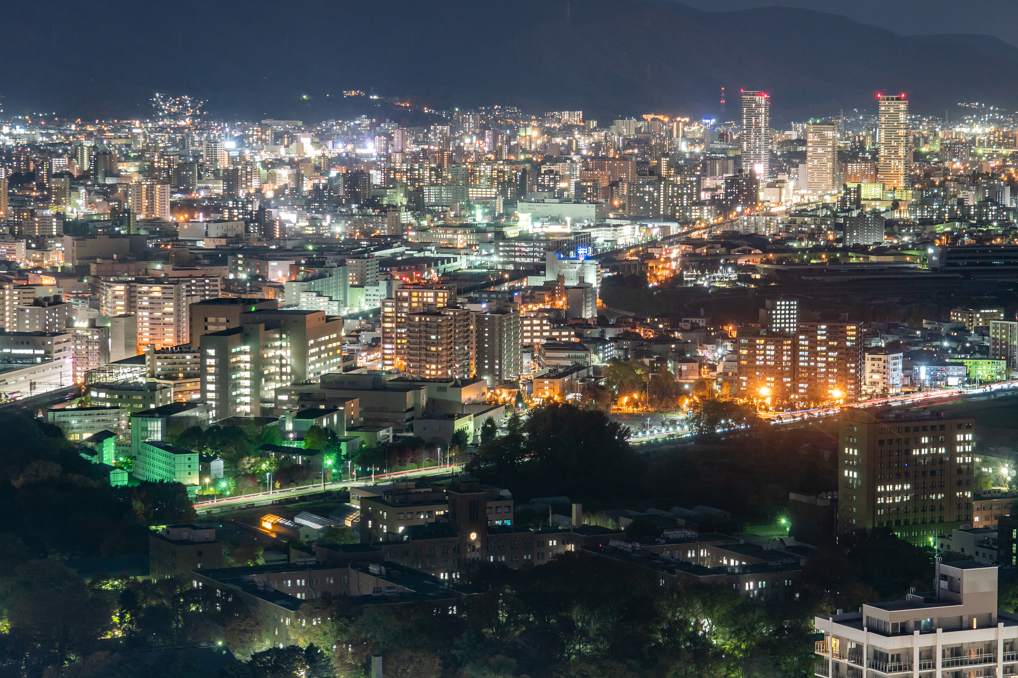 illuminated city buildings in sapporo city of japan
