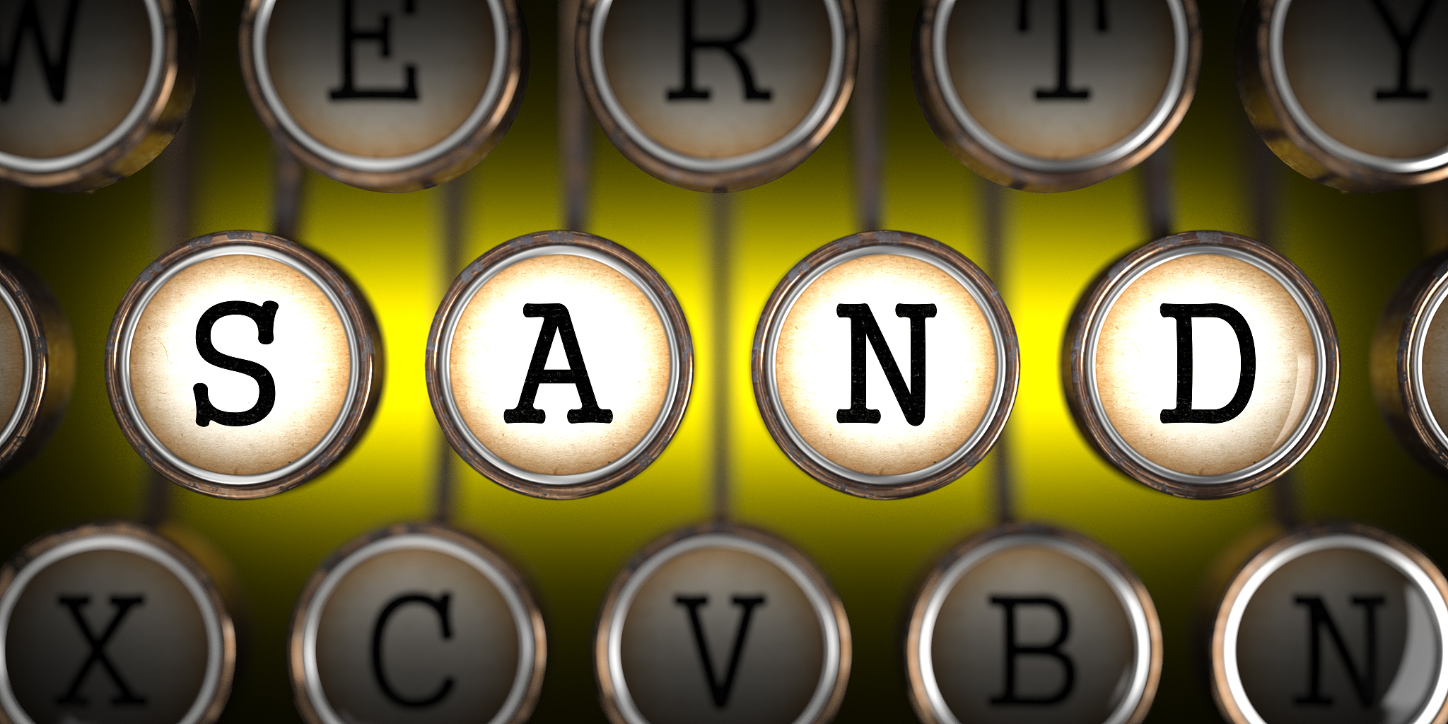 sand - word on old typewriter's keys.