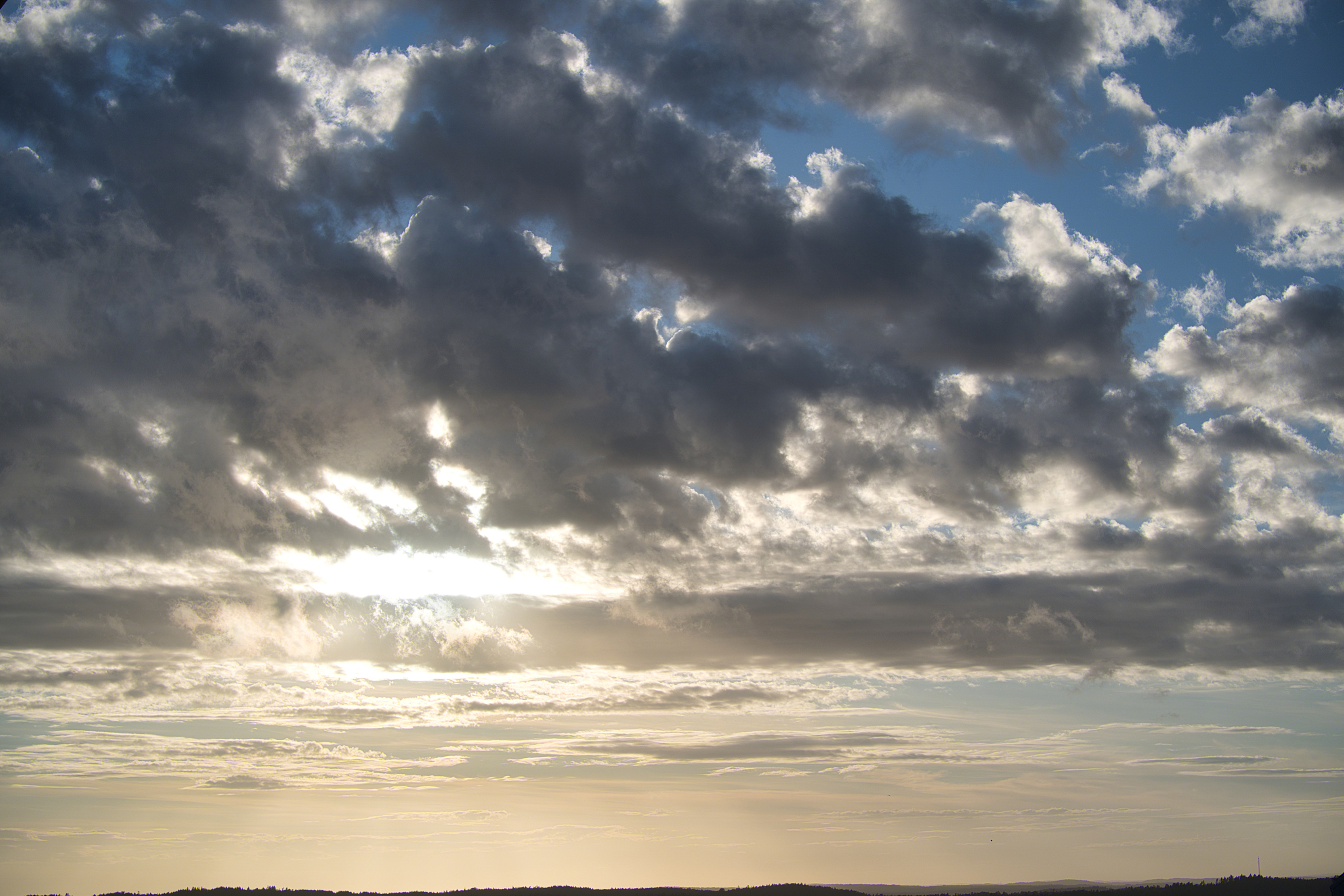 golden sunshine spilling through the gaps in the clouds