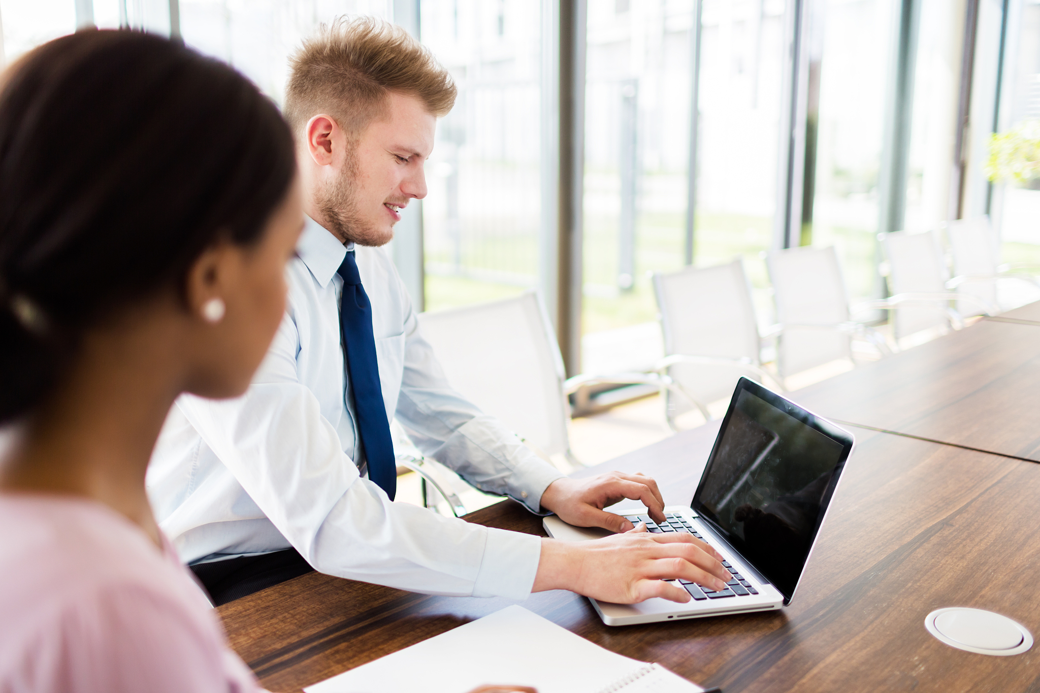 two young business people in modern office