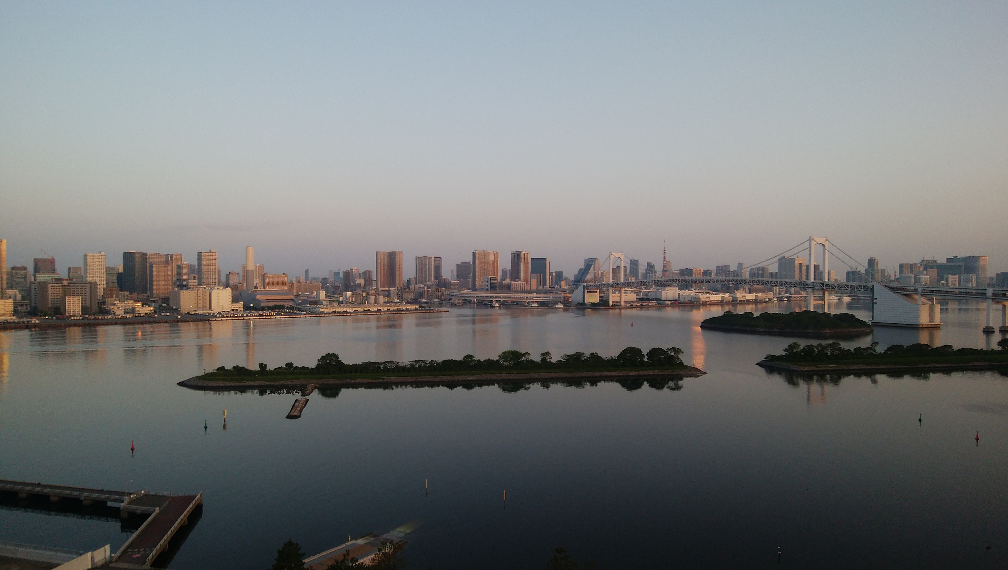 scenic view of buildings by city against clear sky
