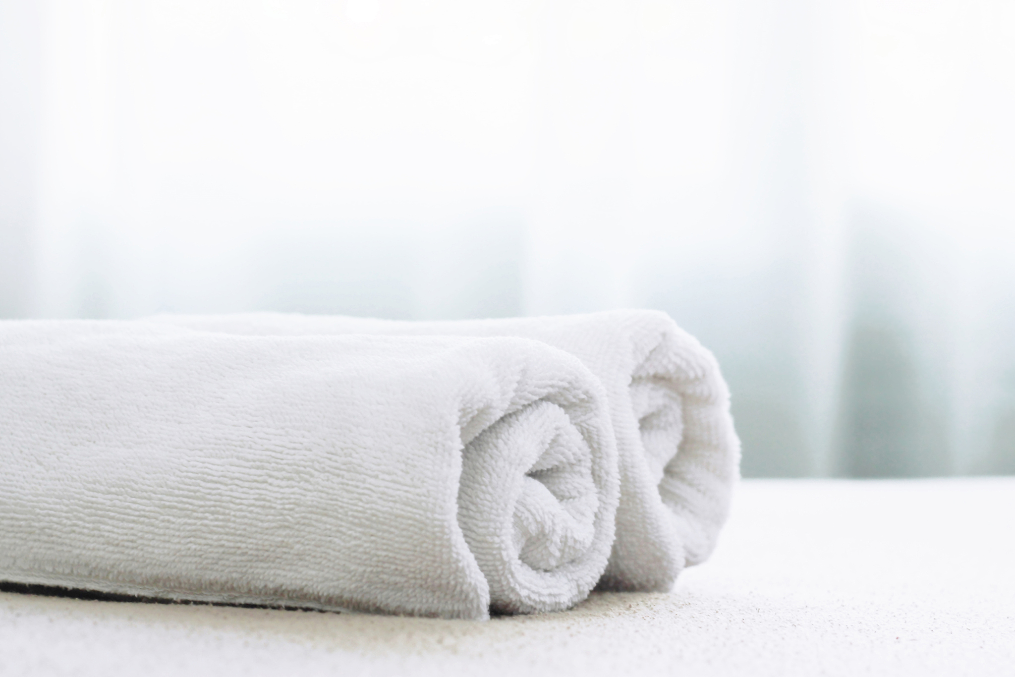 white towel on bed