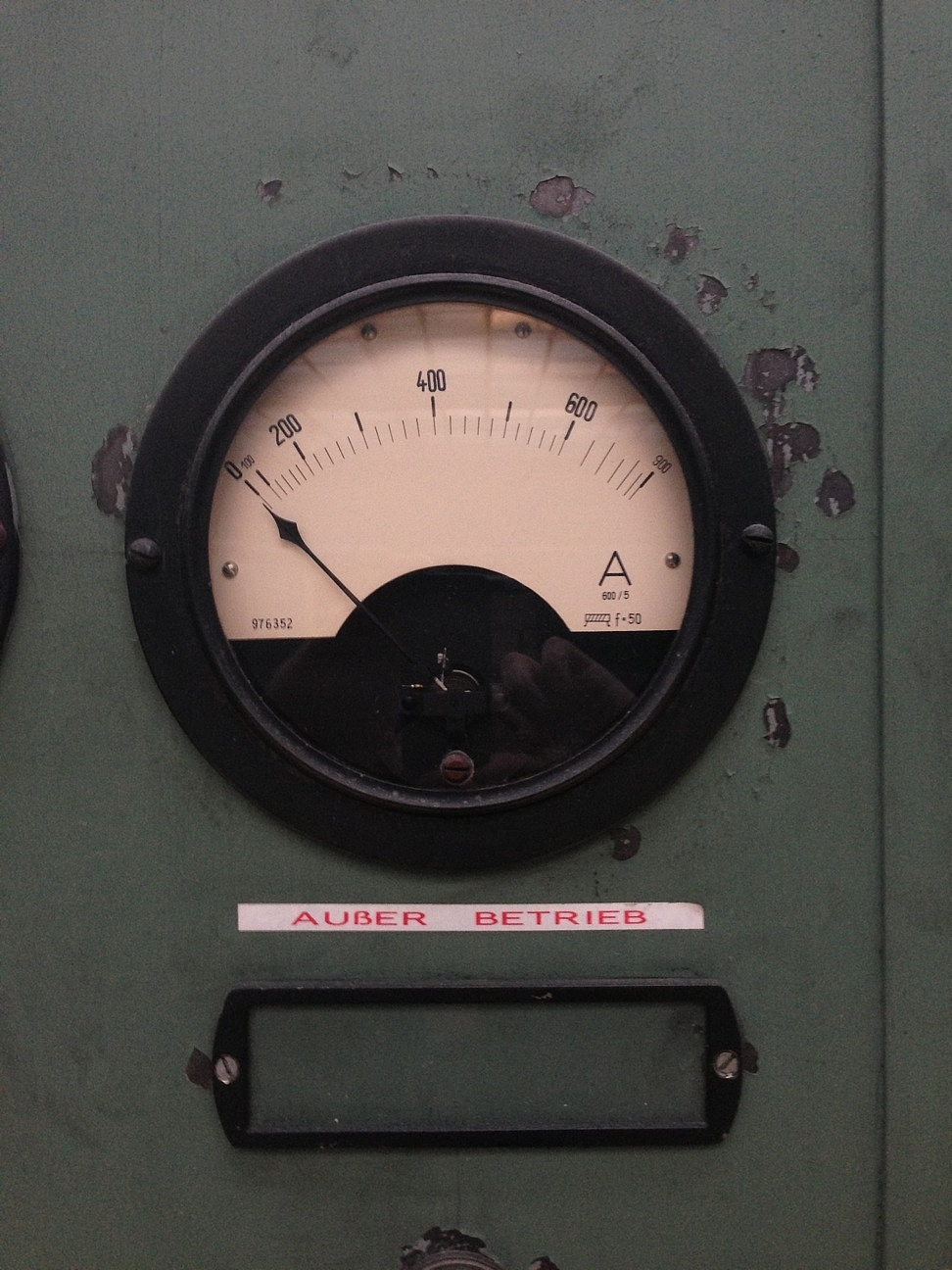 close-up of machine gauge with text