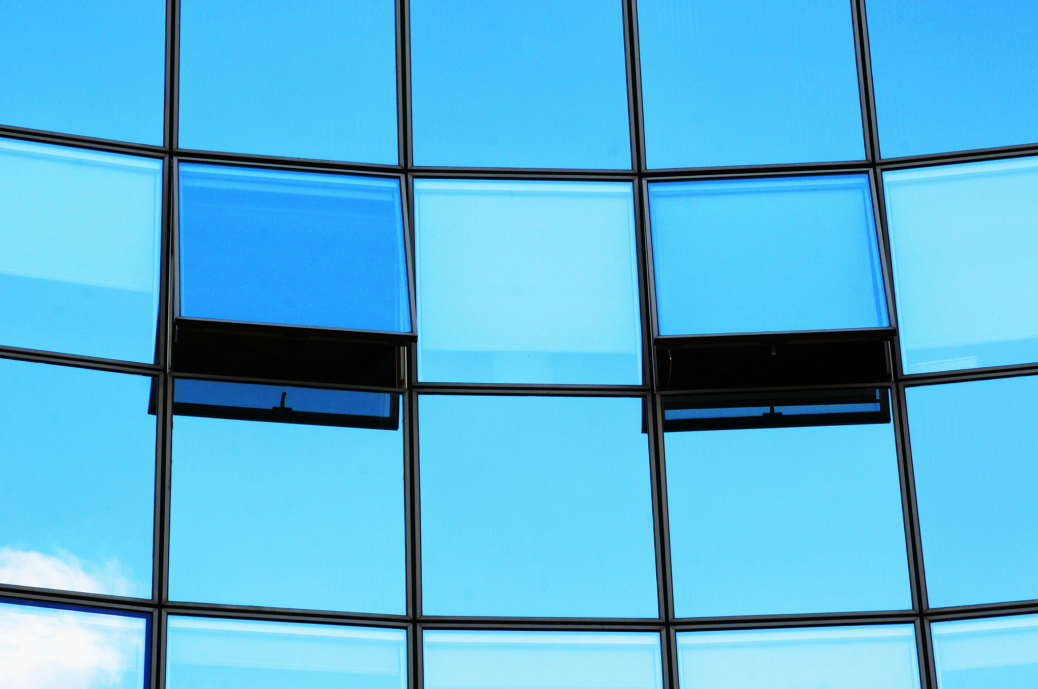 reflection of the sky on a glass building
