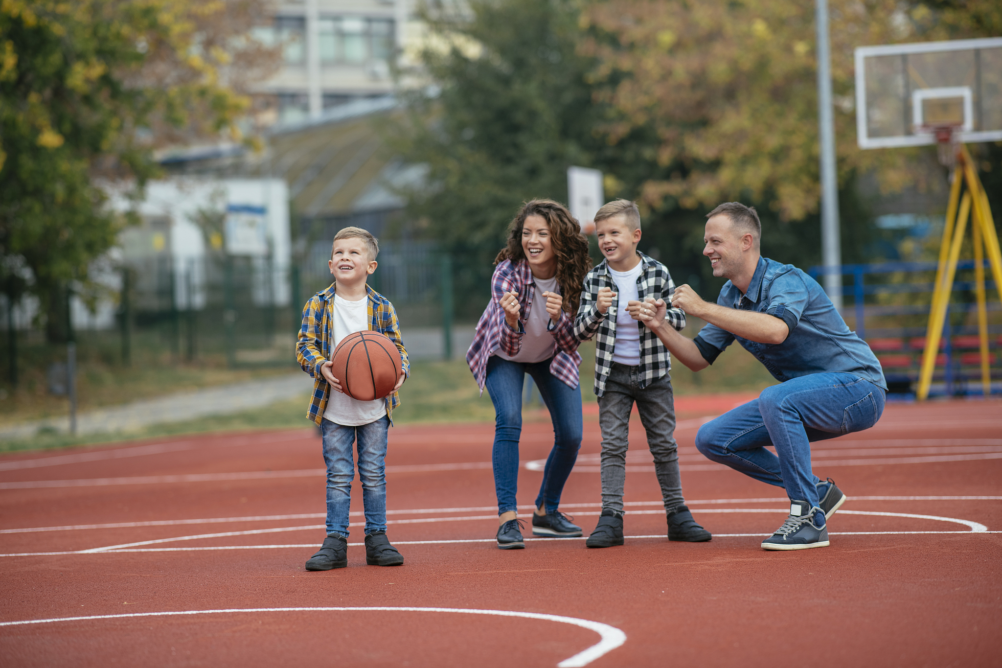 happy family playing basketball