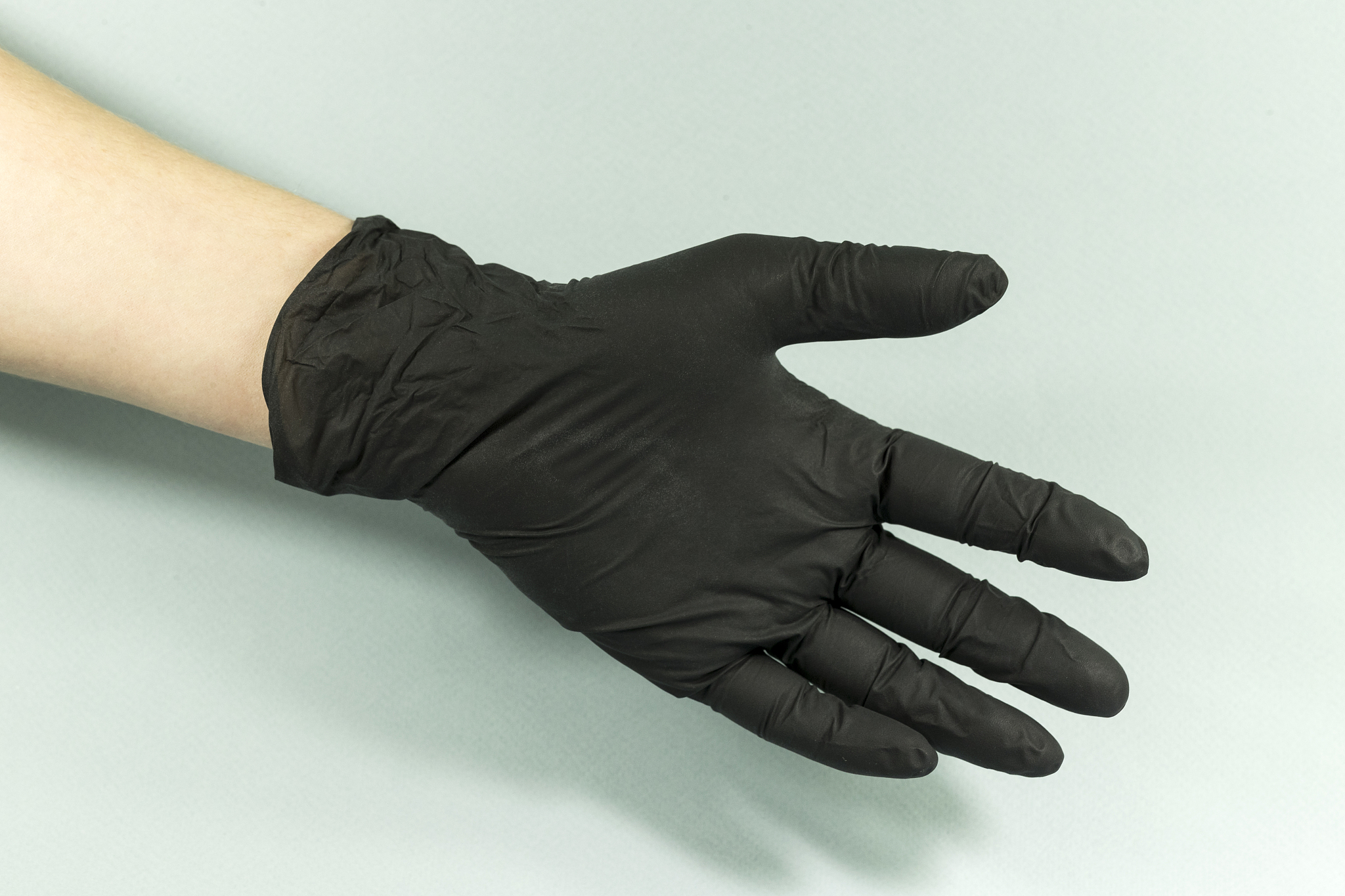 hand gestures on a gray background in a sterile rubber glove sho