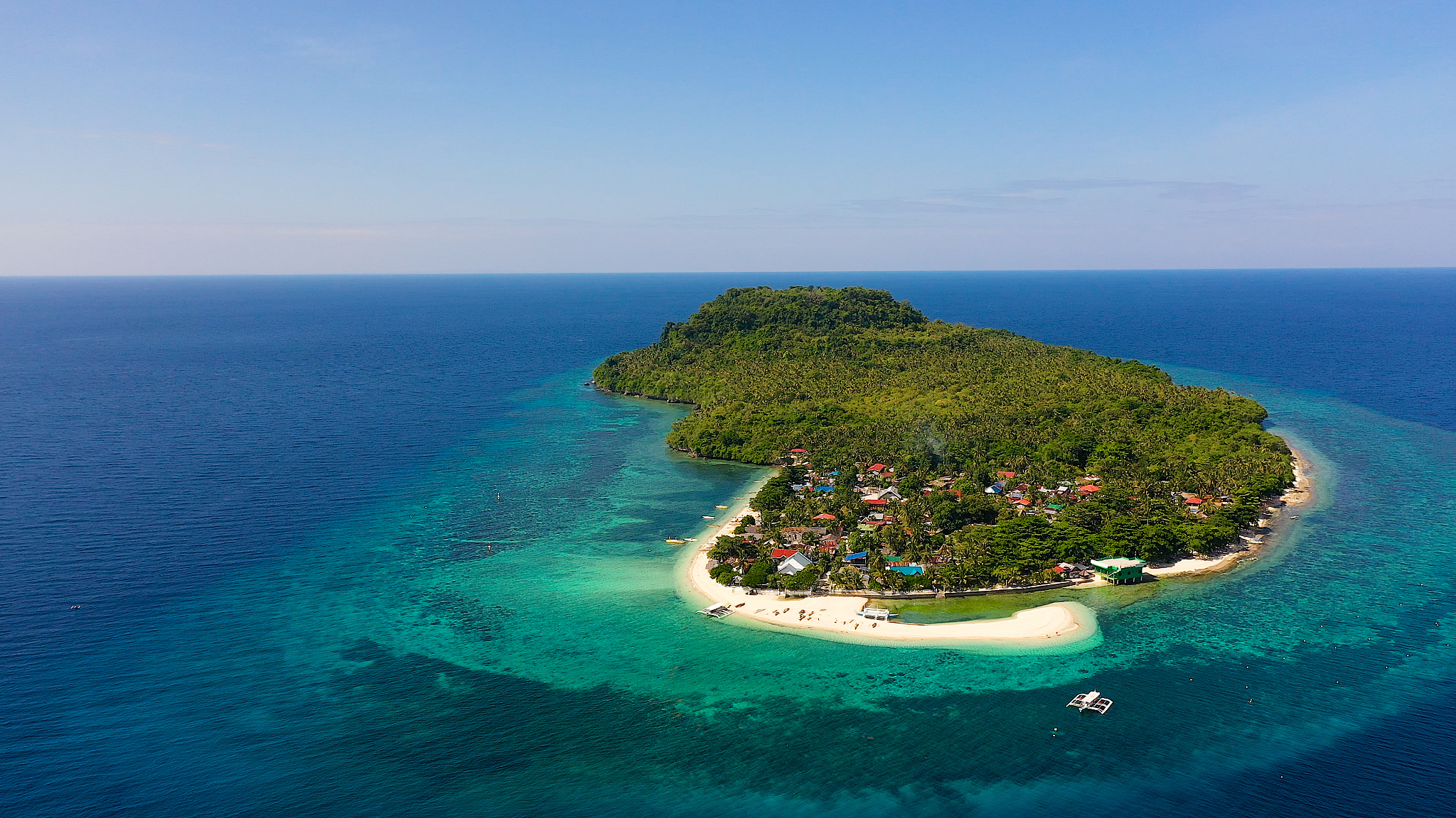 white sand beach and boats. tropical island for tourists, top vi