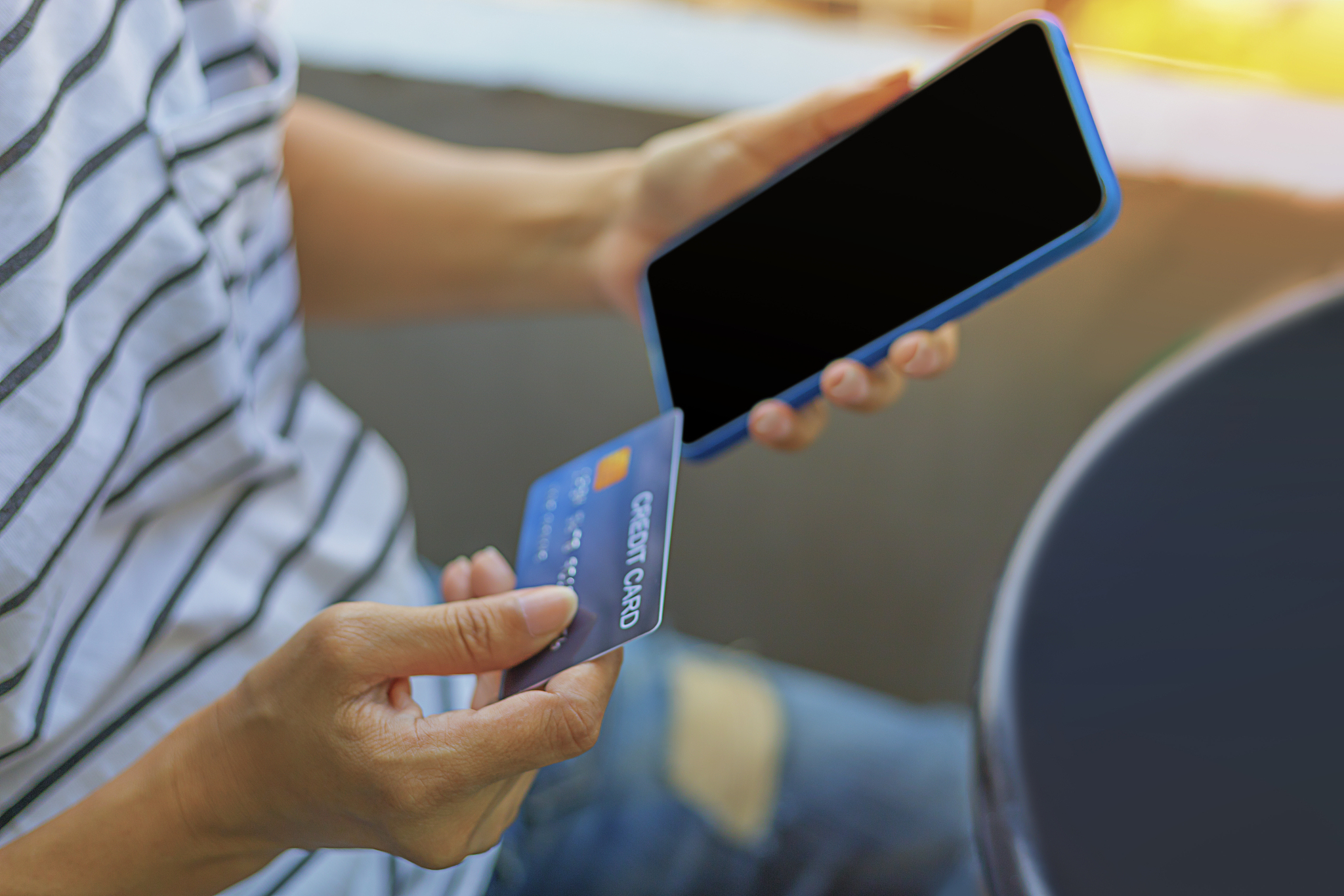 e-commerce and modern technology, holding credit card and mobile