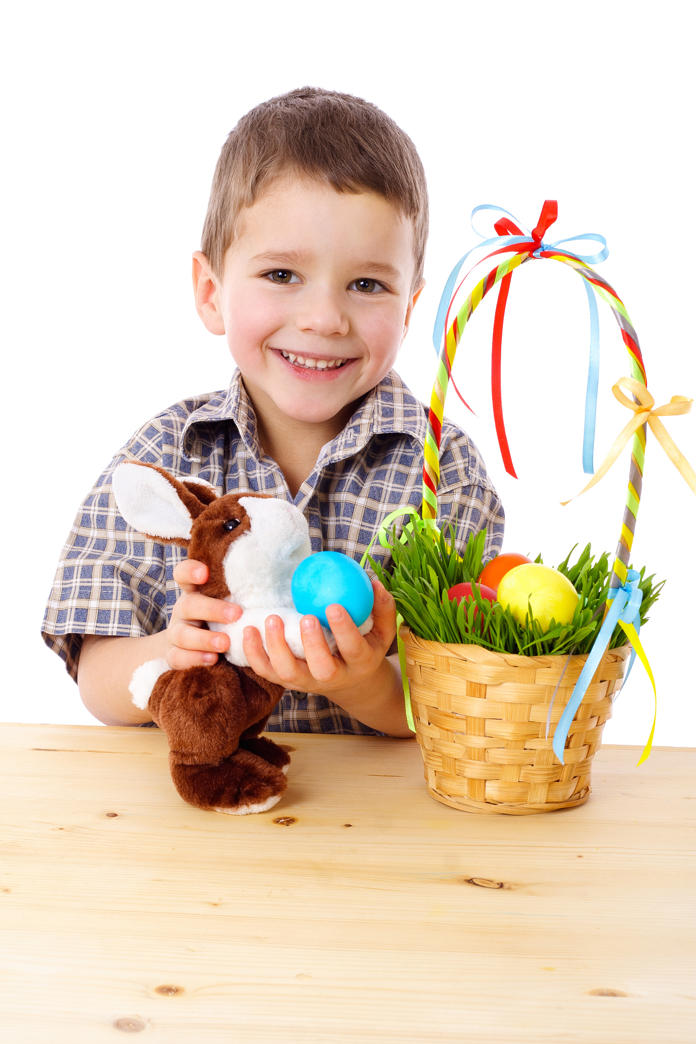 smiling boy with easter eggs and bunny