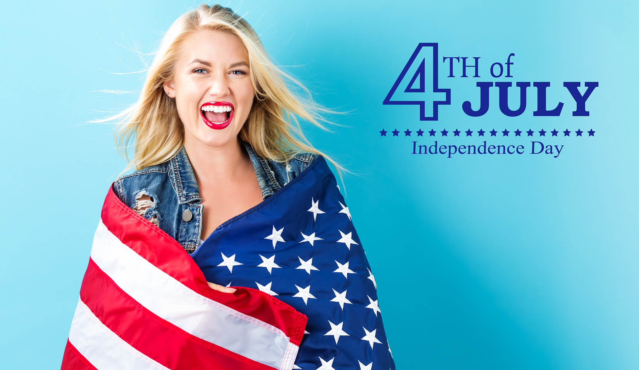 young woman with an american flag on the fourth of july