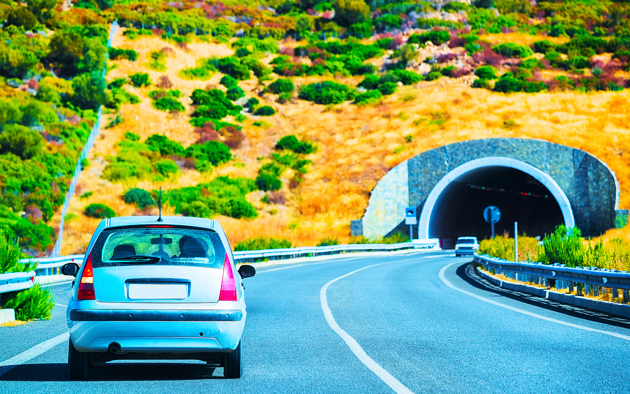 car on road with underpass in cagliari sardinia reflex