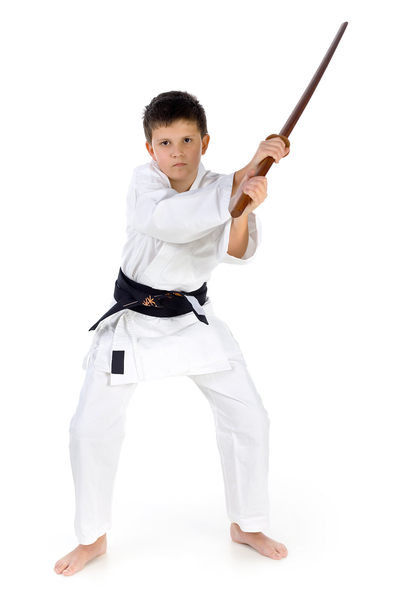 karate boy posing with wooden sword