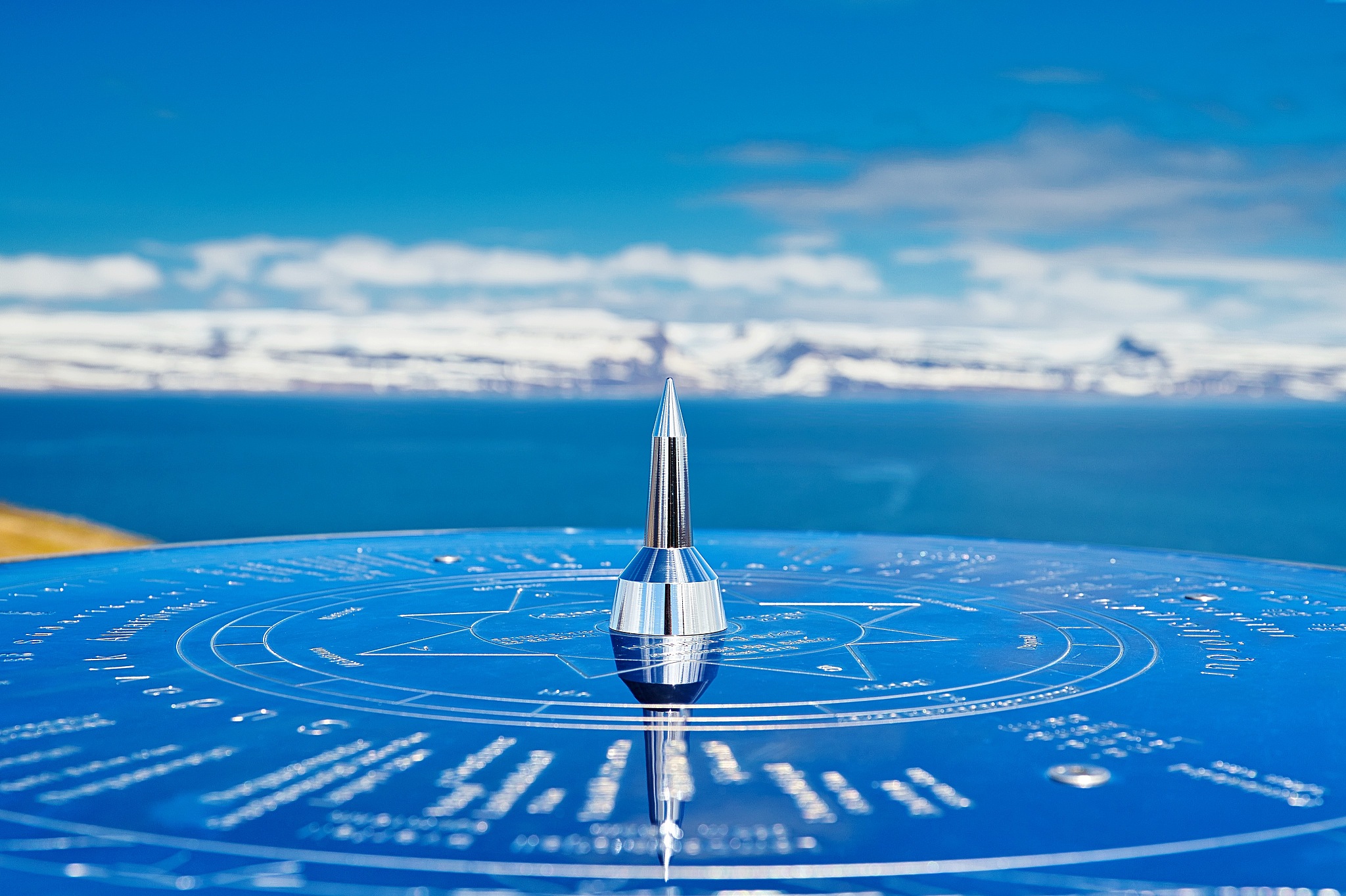 close-up of navigational equipment against sea and blue sky