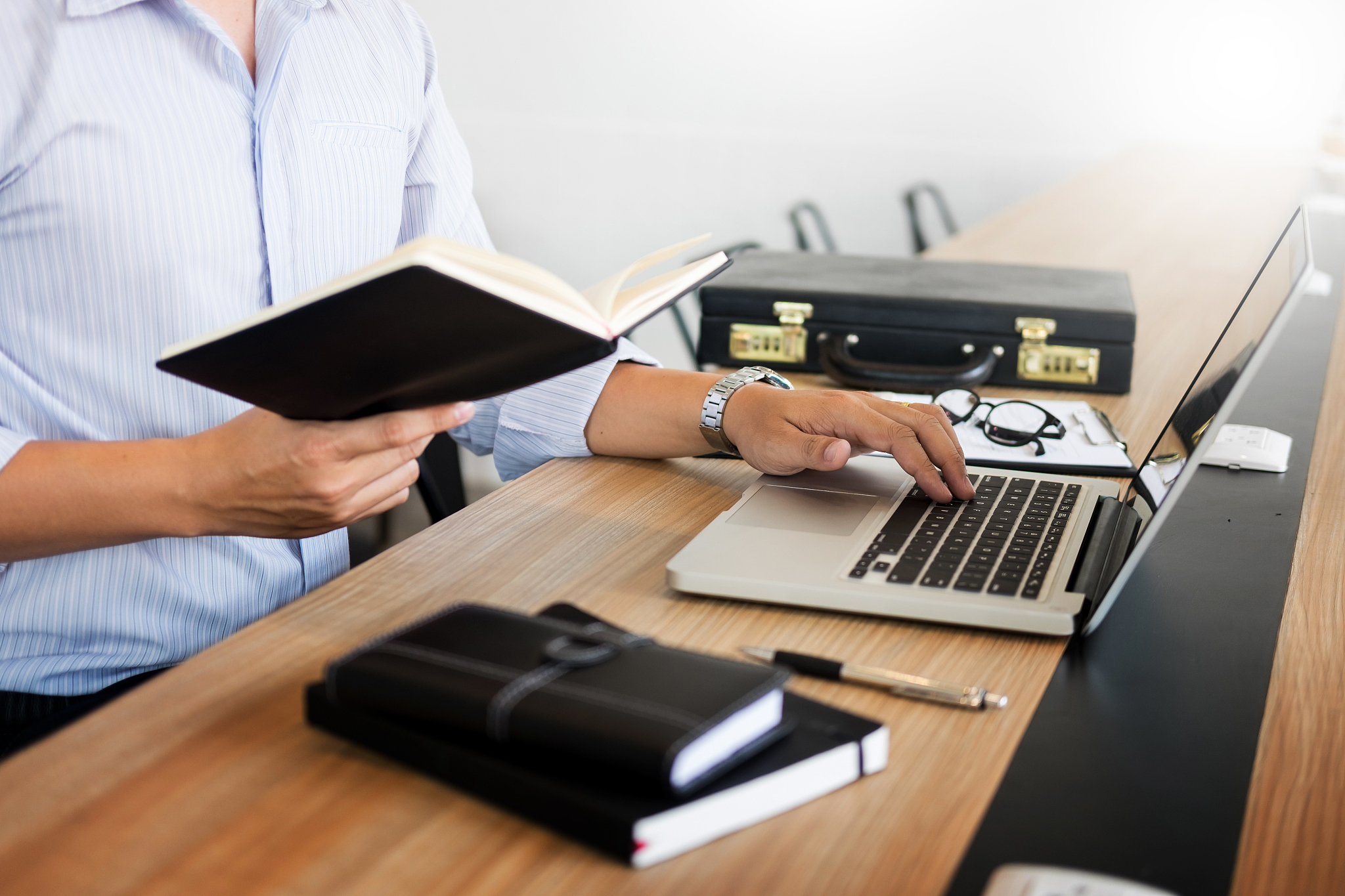 midsection of businessman using laptop at office