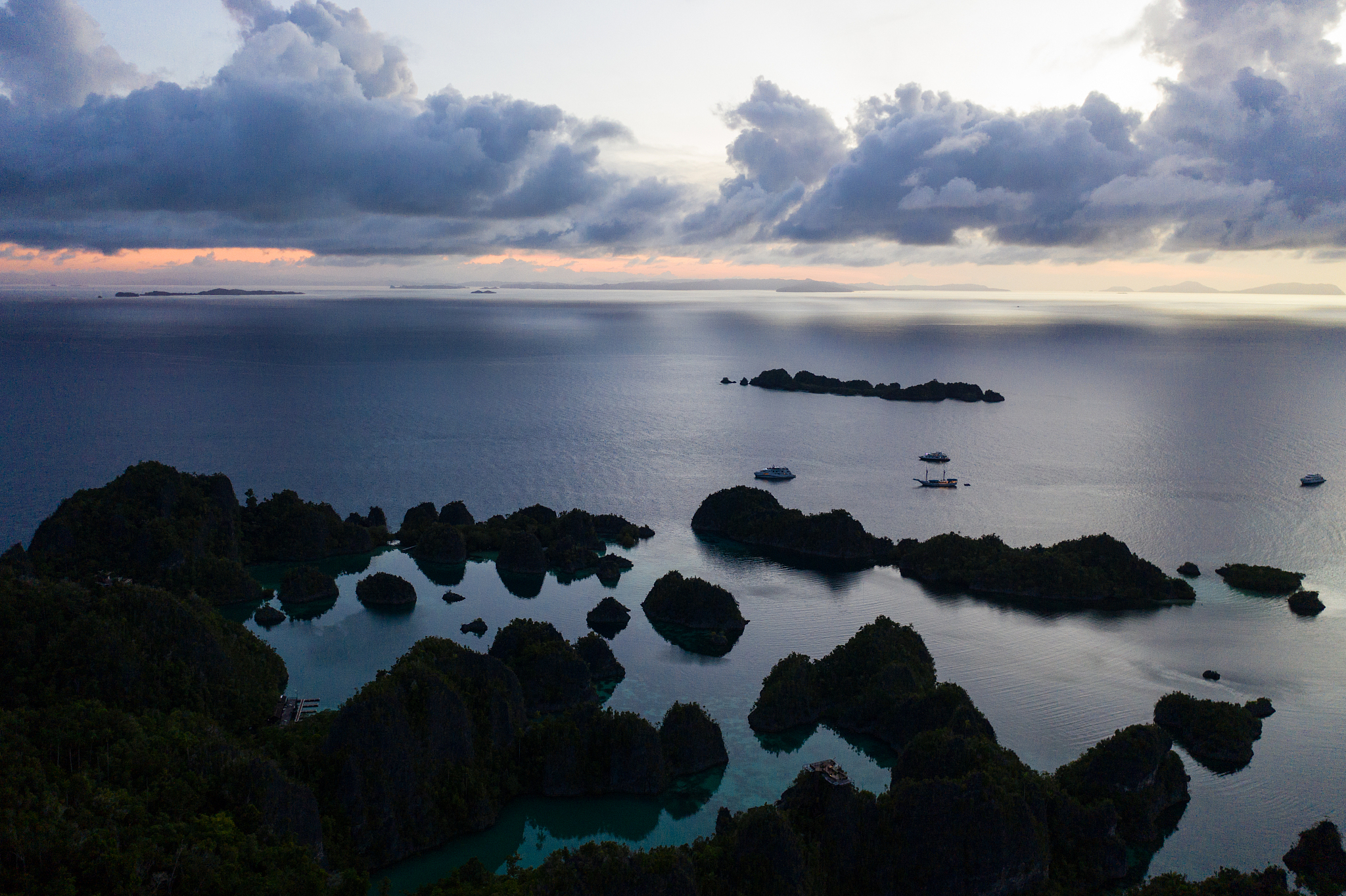 aerial view of islands at sunrise in raja ampat