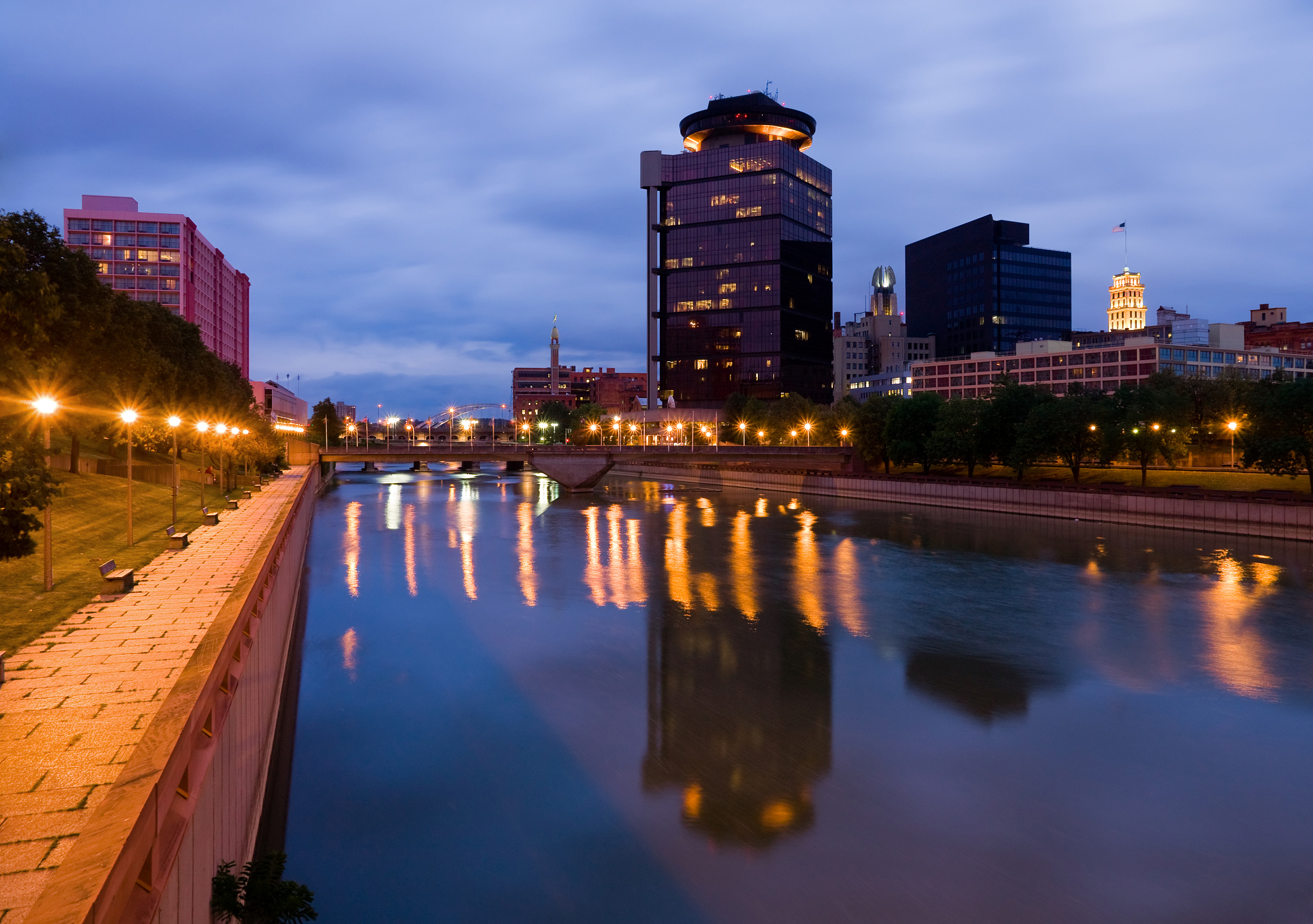 reflections in river at twilight in rochester, new york