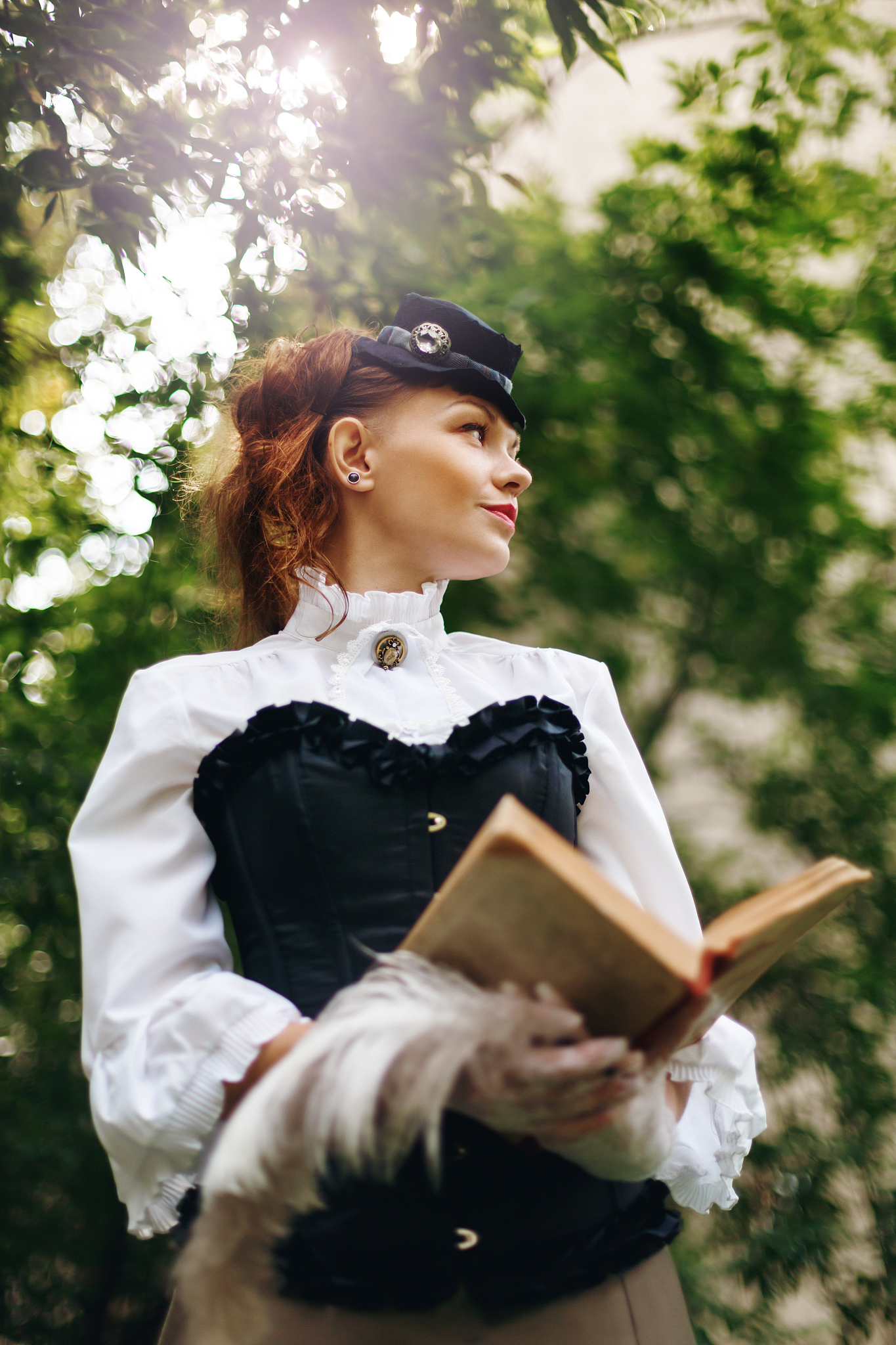 woman in vintage clothes reading book