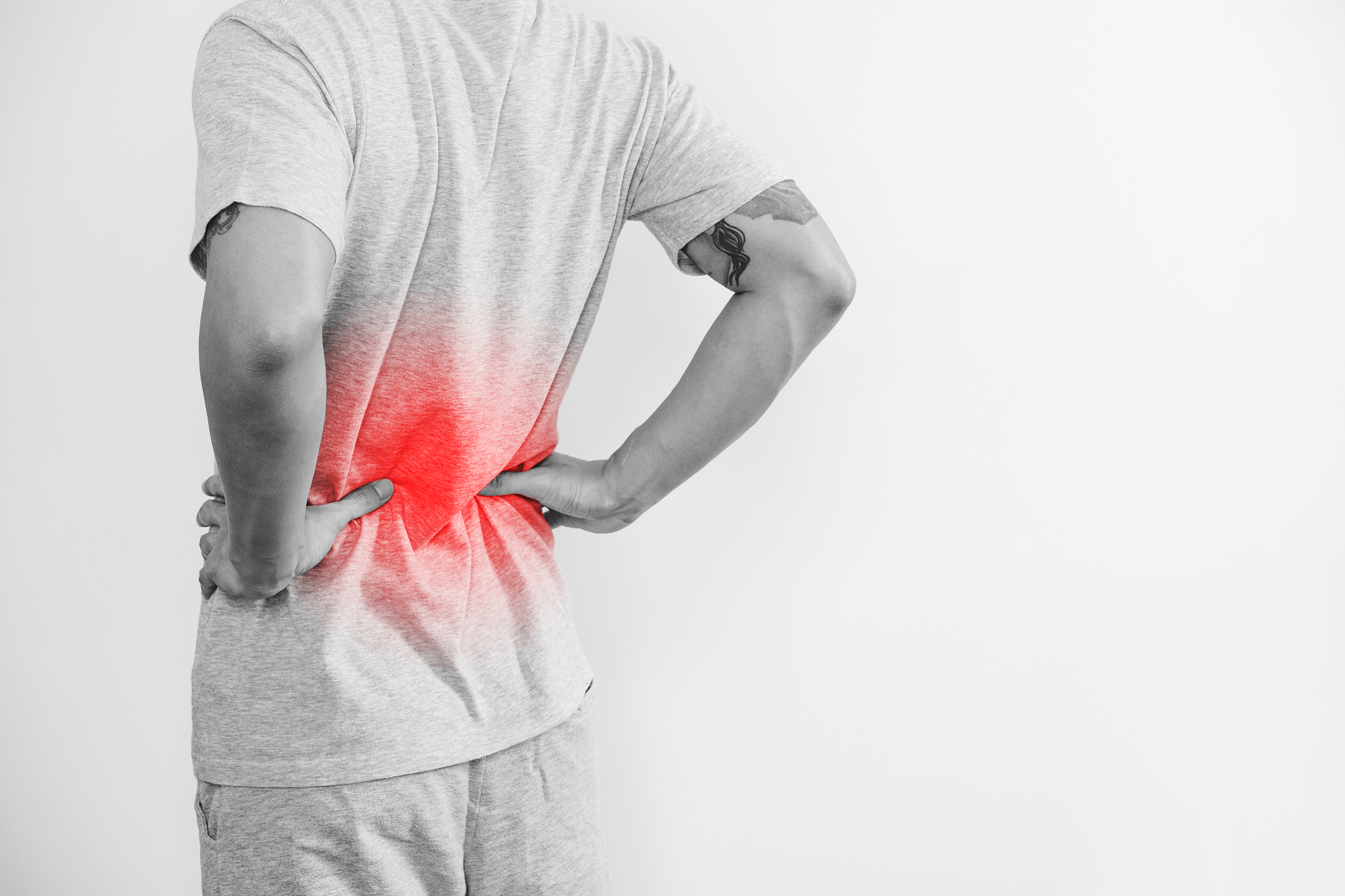 a man touching his back, with red highlight. back pain, backache