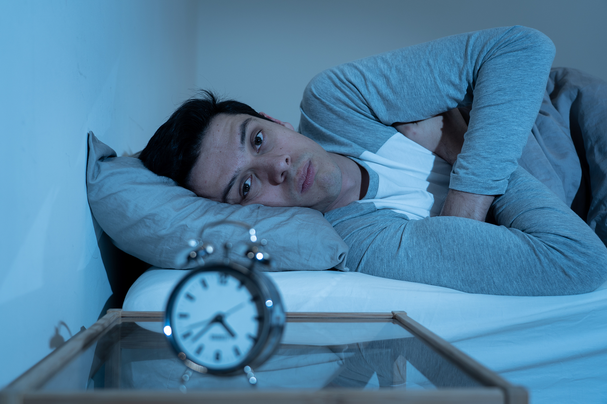 sleepless and desperate young caucasian man awake at night not a