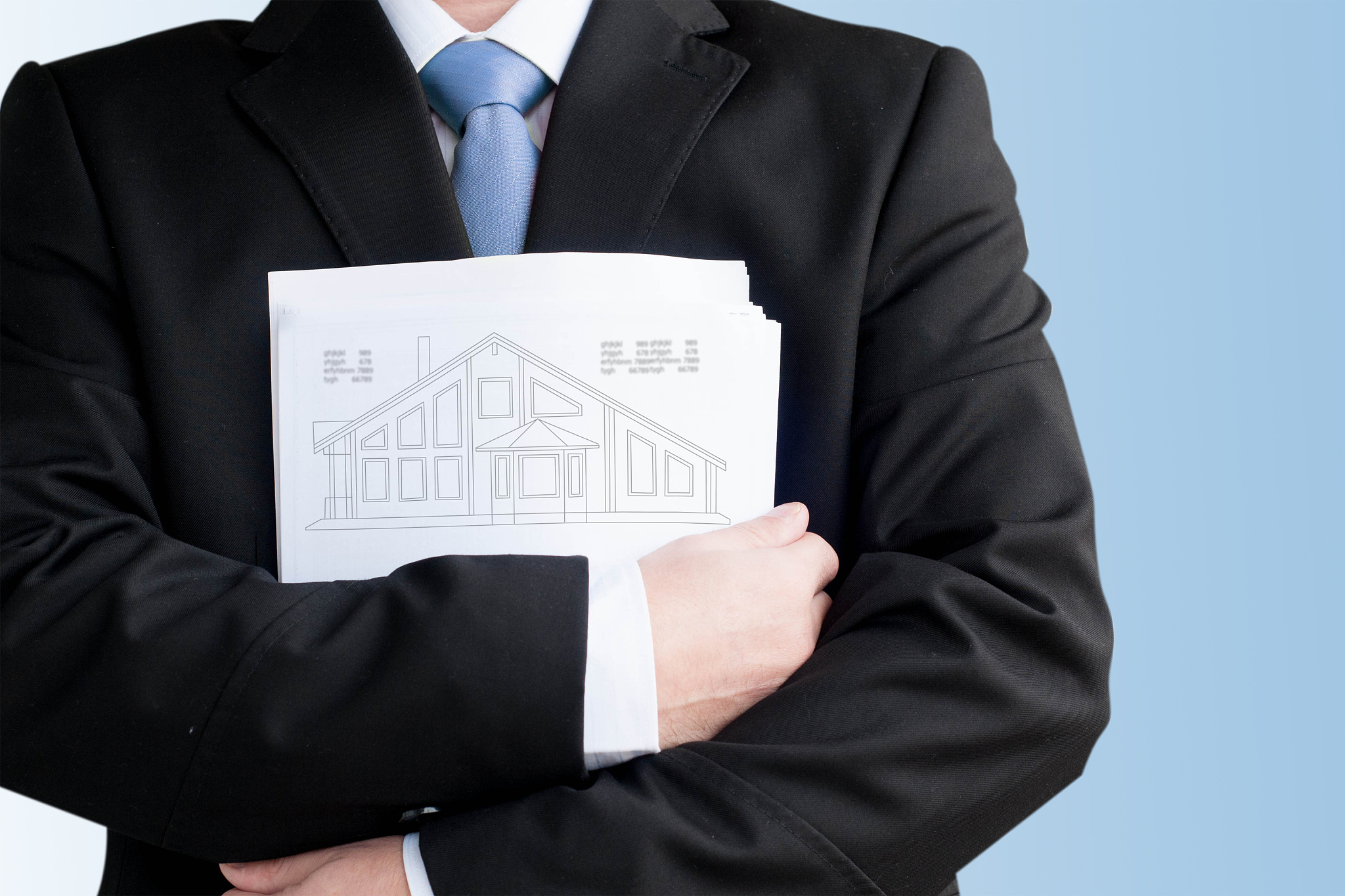 businessmen with project of family house