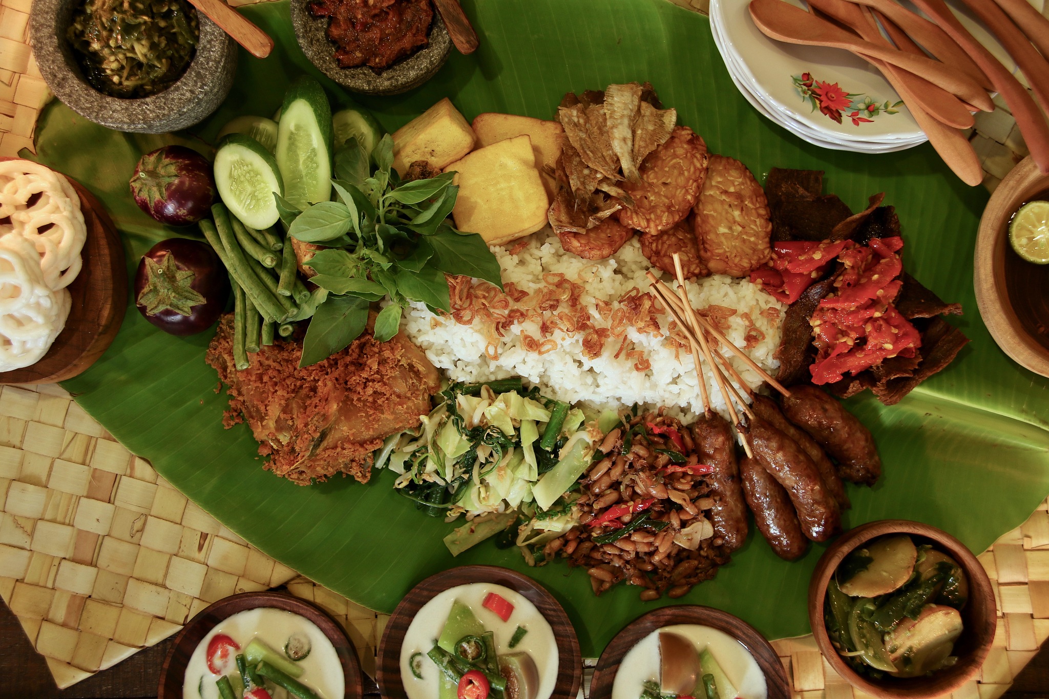 indonesian rijsttafel on banana leaf