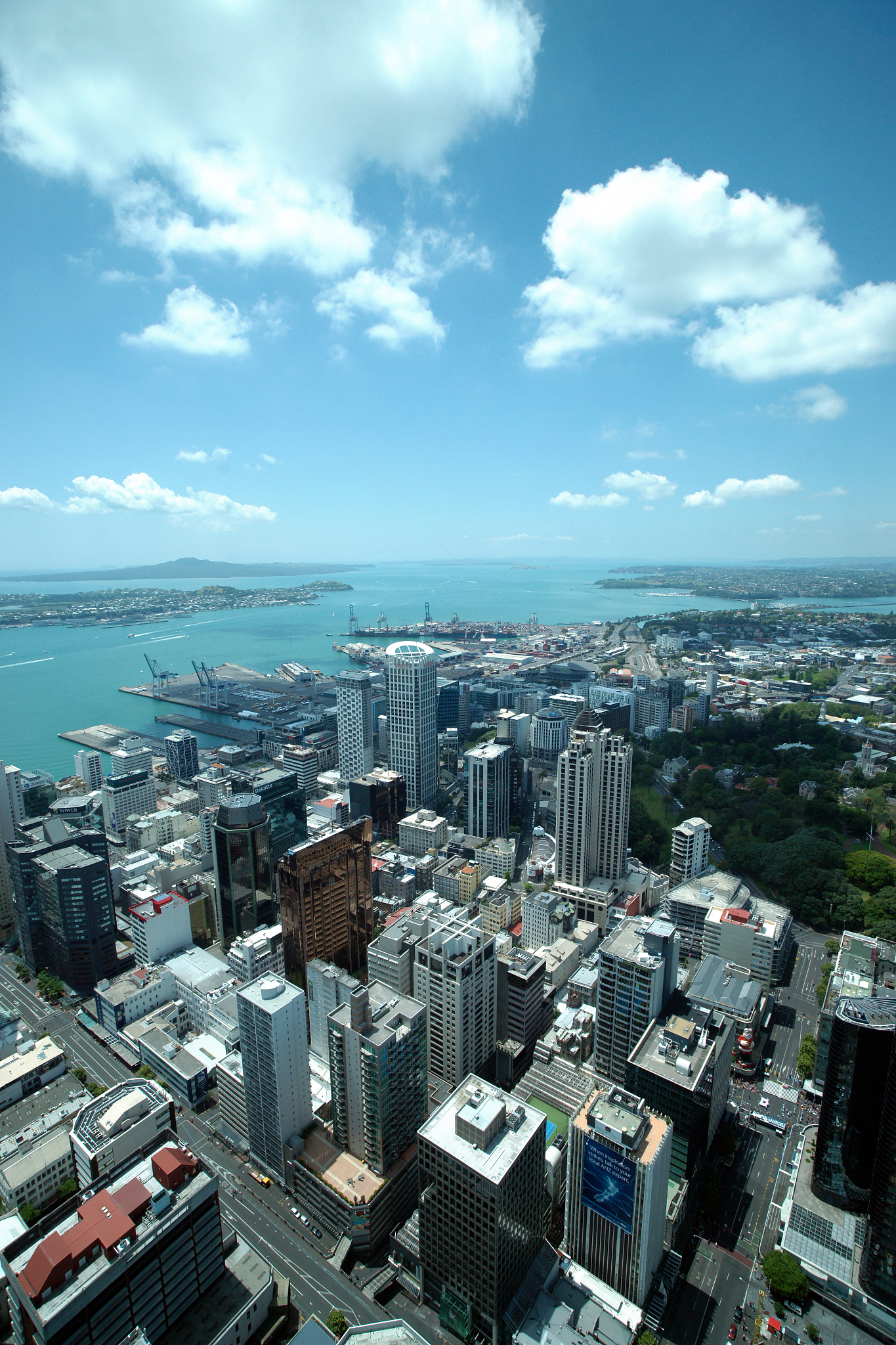 high angle view of cityscape by sea against sky
