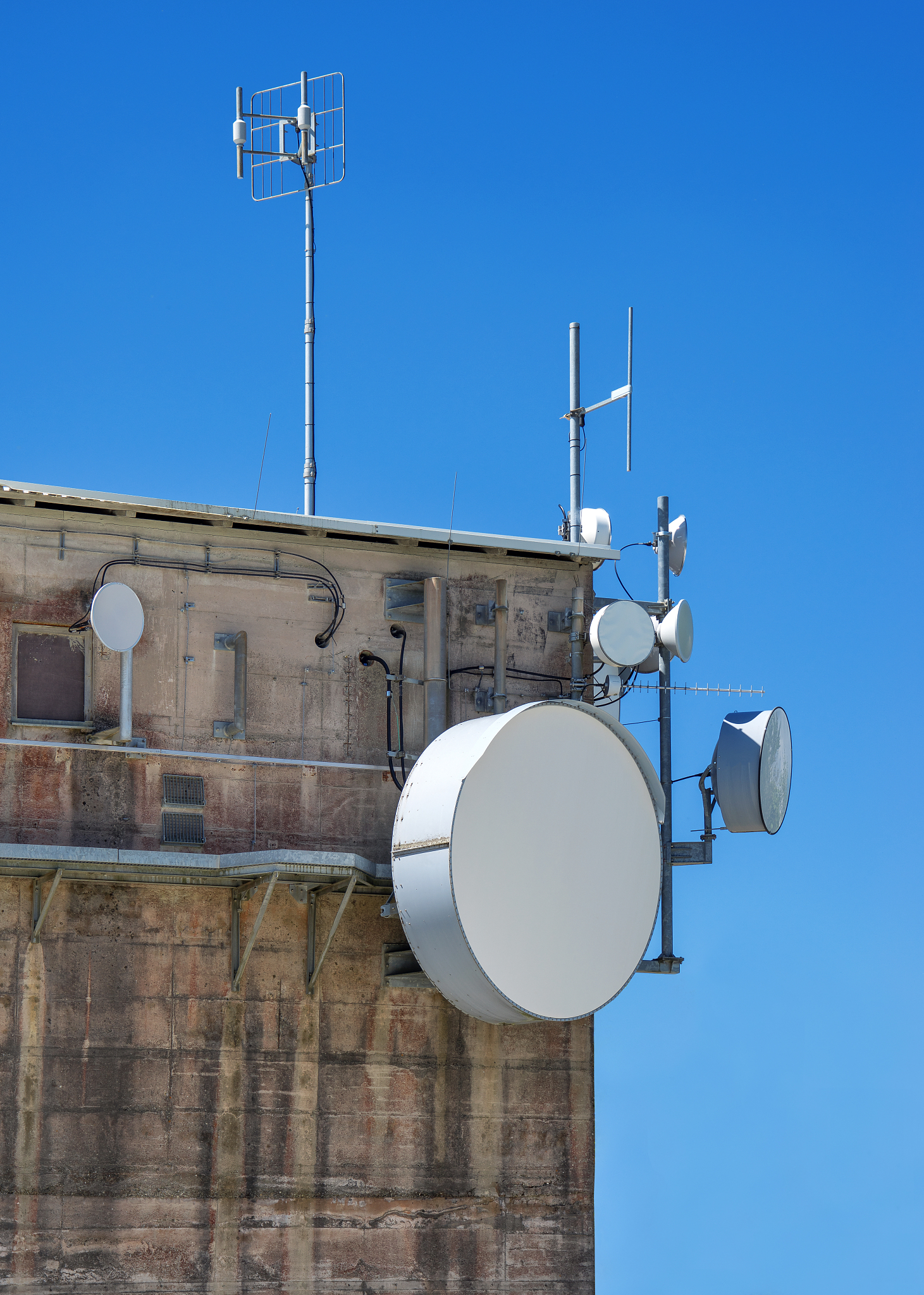 modern antennas on an old industrial building