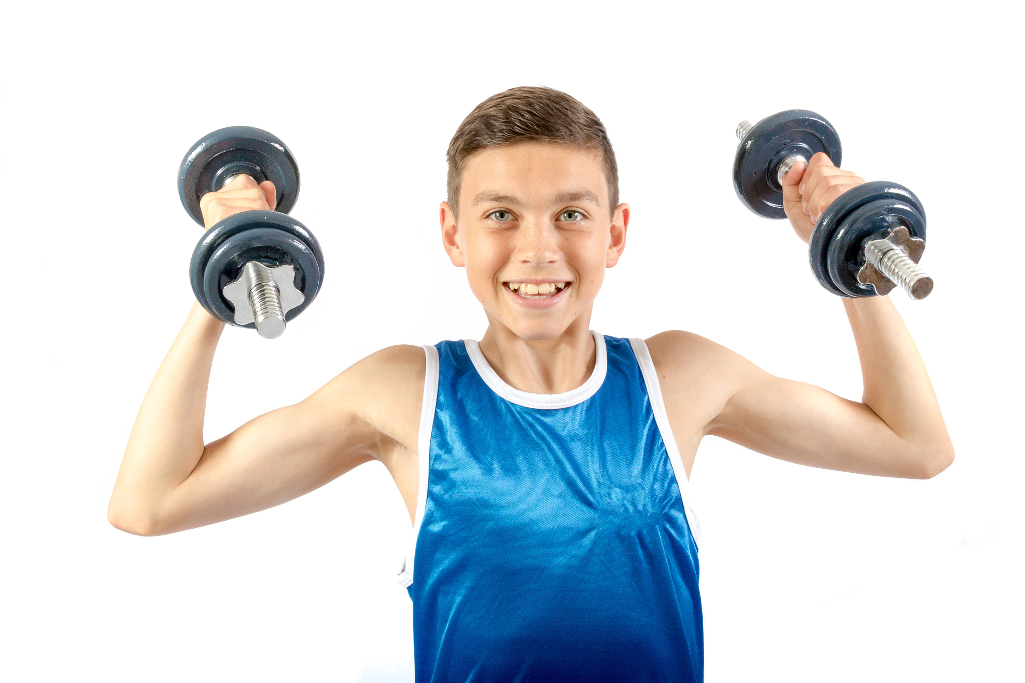 young teenage boy using dumbbells