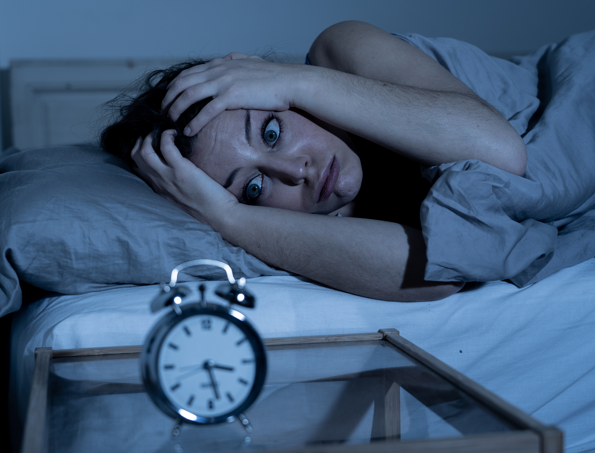 sleepless and desperate beautiful caucasian woman awake at night