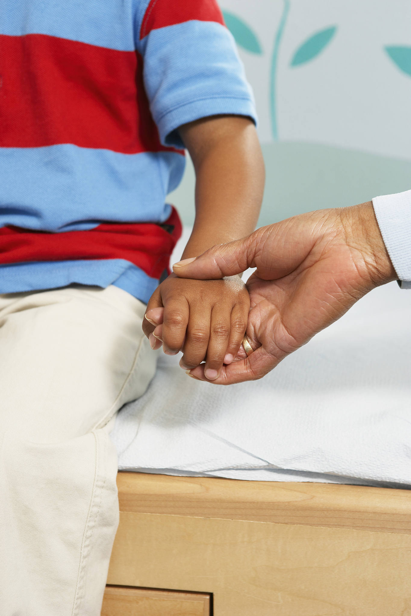 doctor examining girl at clinic