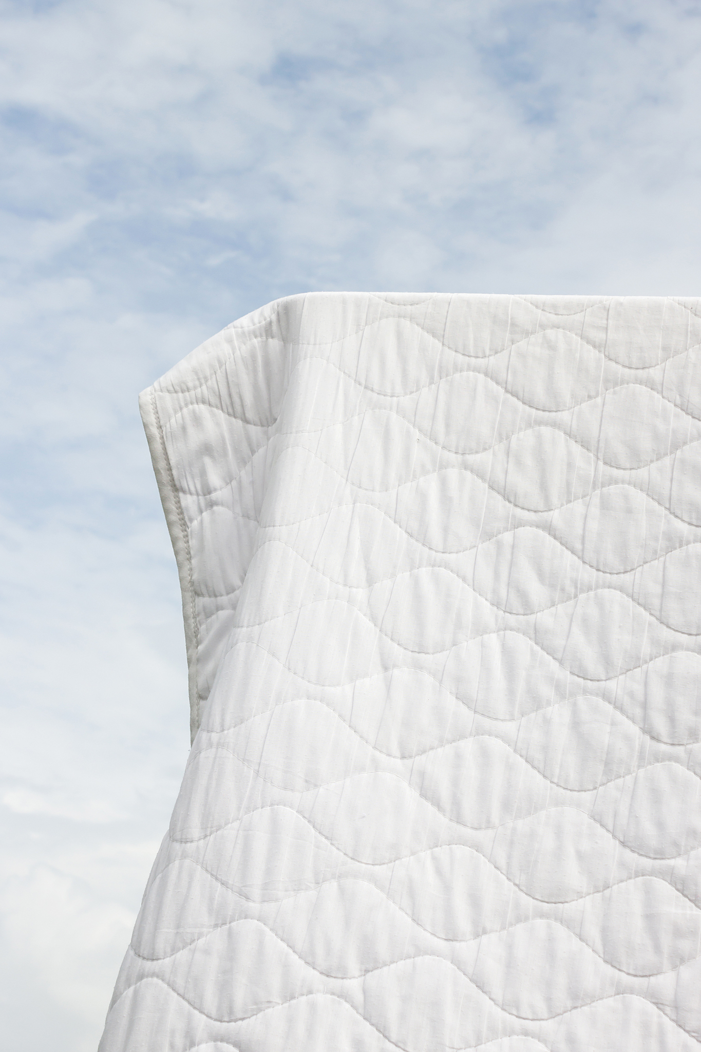 clean bedding hanging to dry.