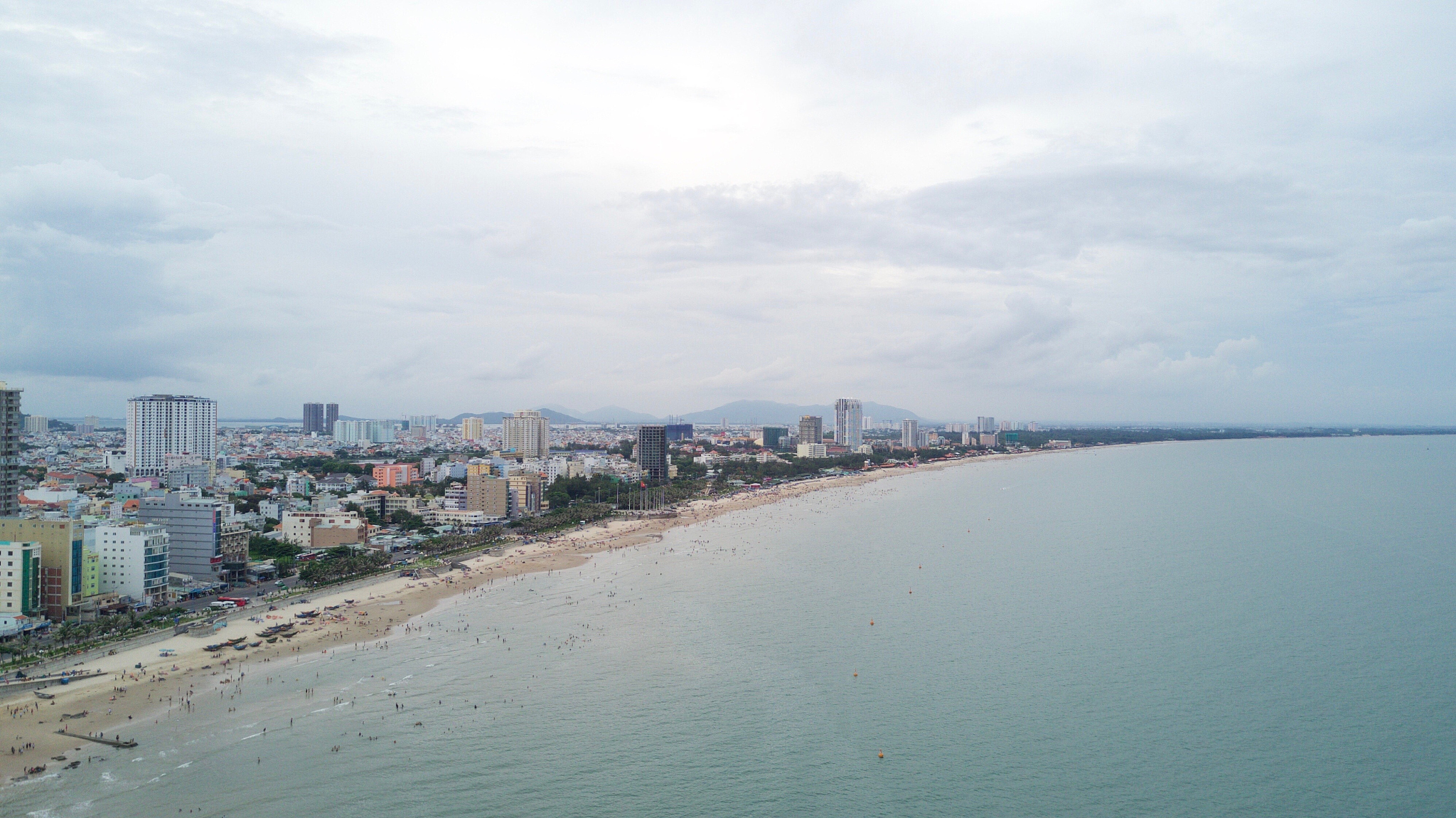 cityscape by sea against sky