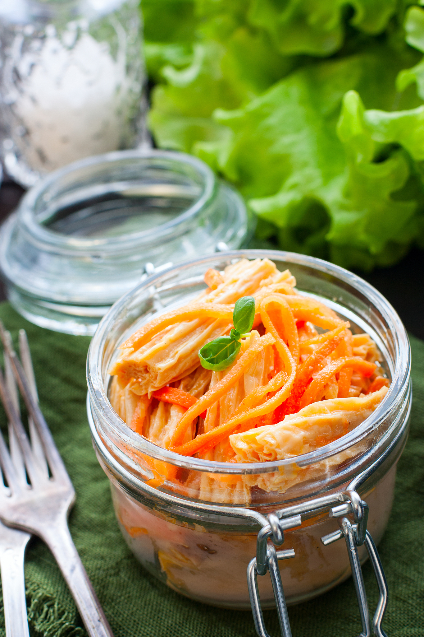 salad with soy asparagus with sharp carrots in a glass jar