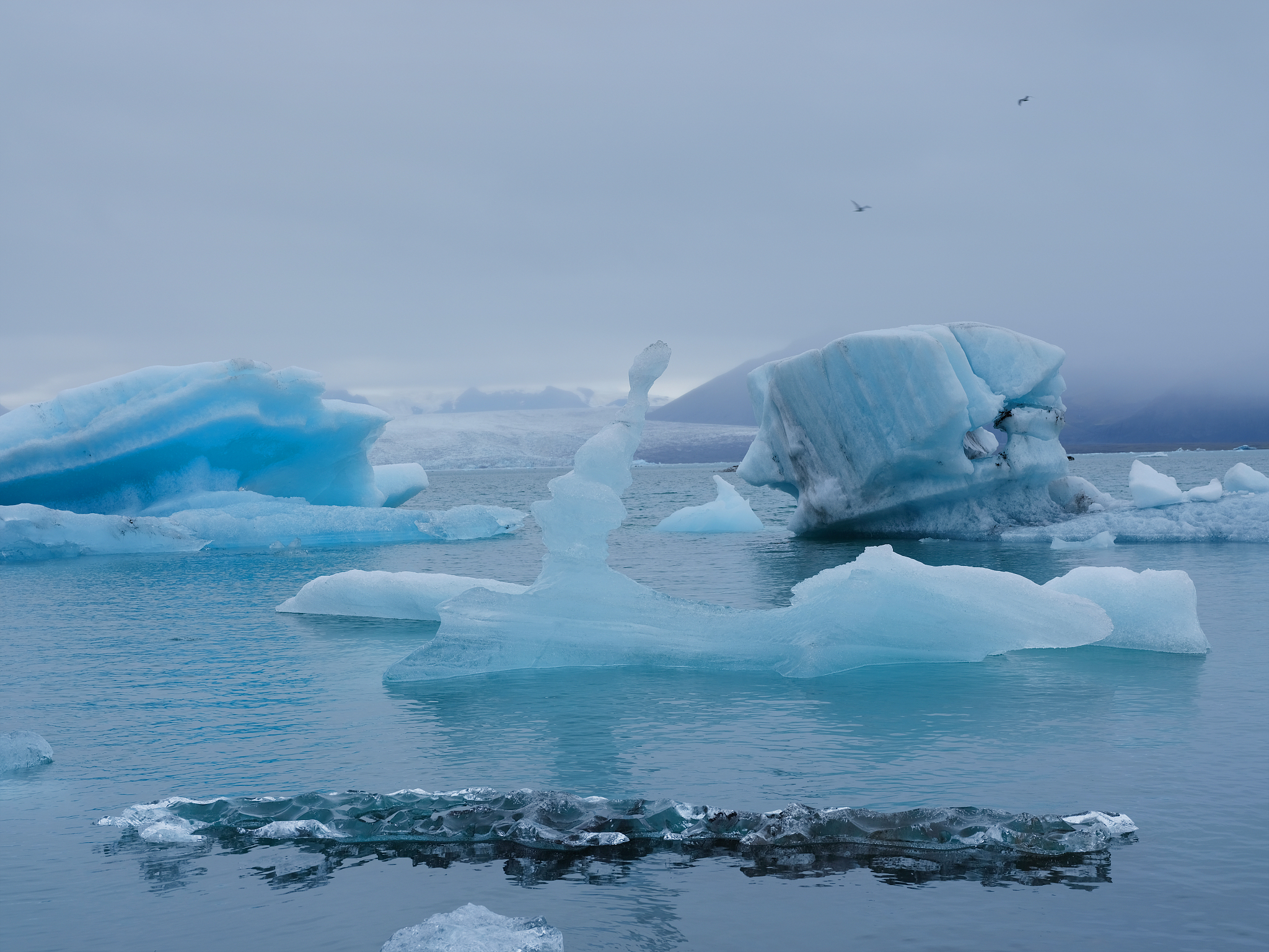 scenic view of frozen sea against sky