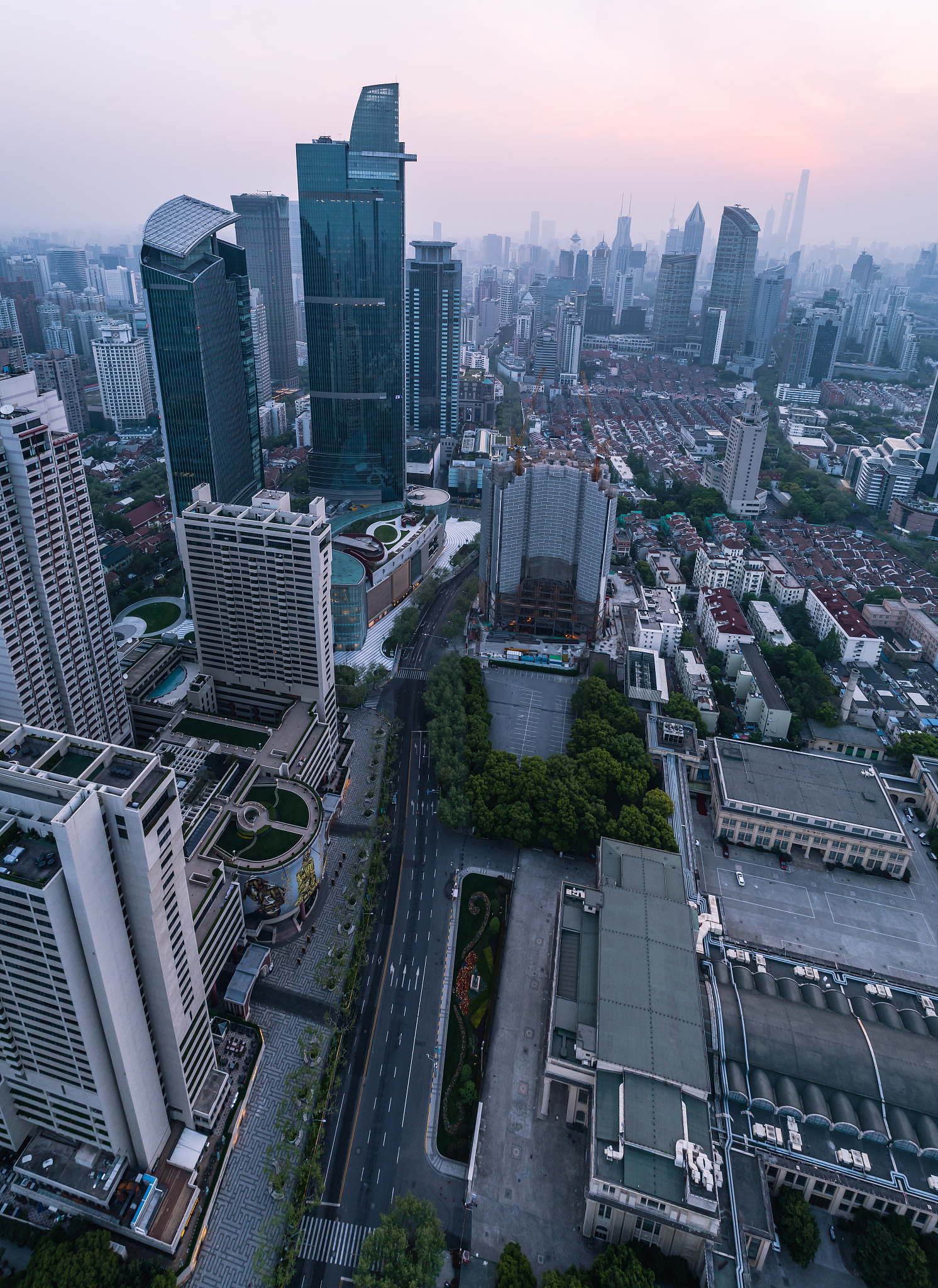 aerial view of business area and cityscape in foggy dawn, west n