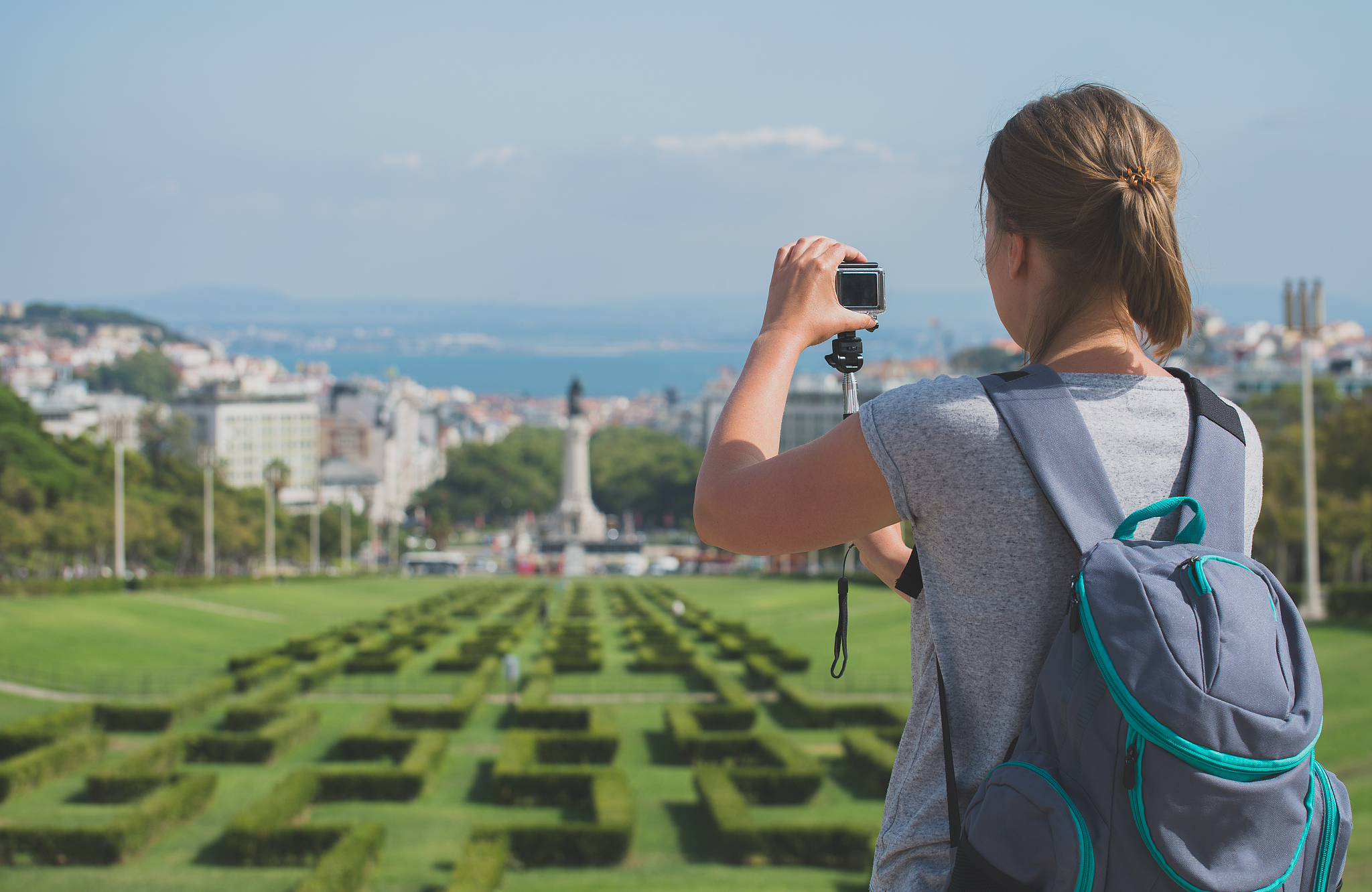 woman tourist with camera in eduardo vii park in lisbon.