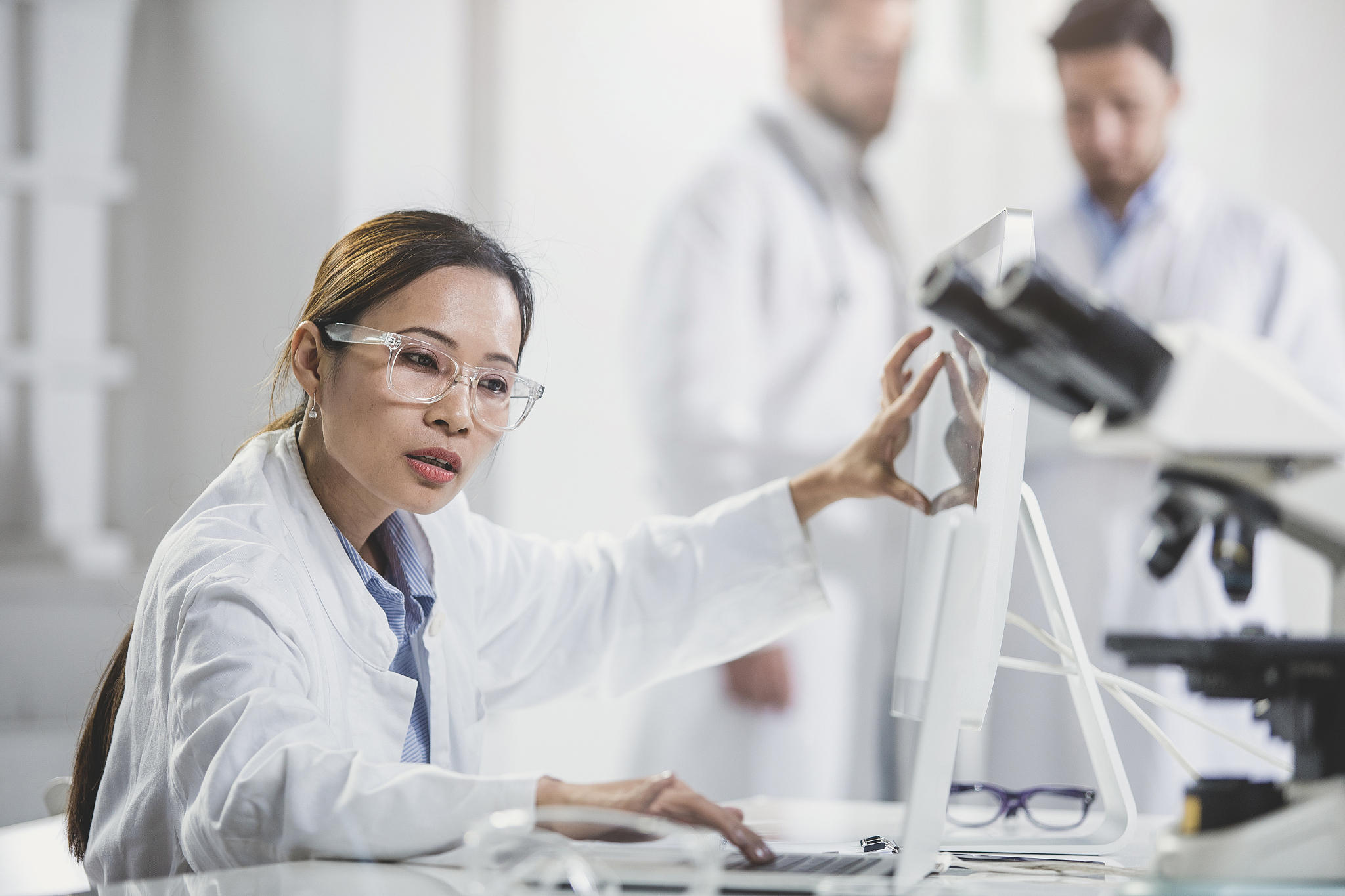 female doctor pointing at computer monitor