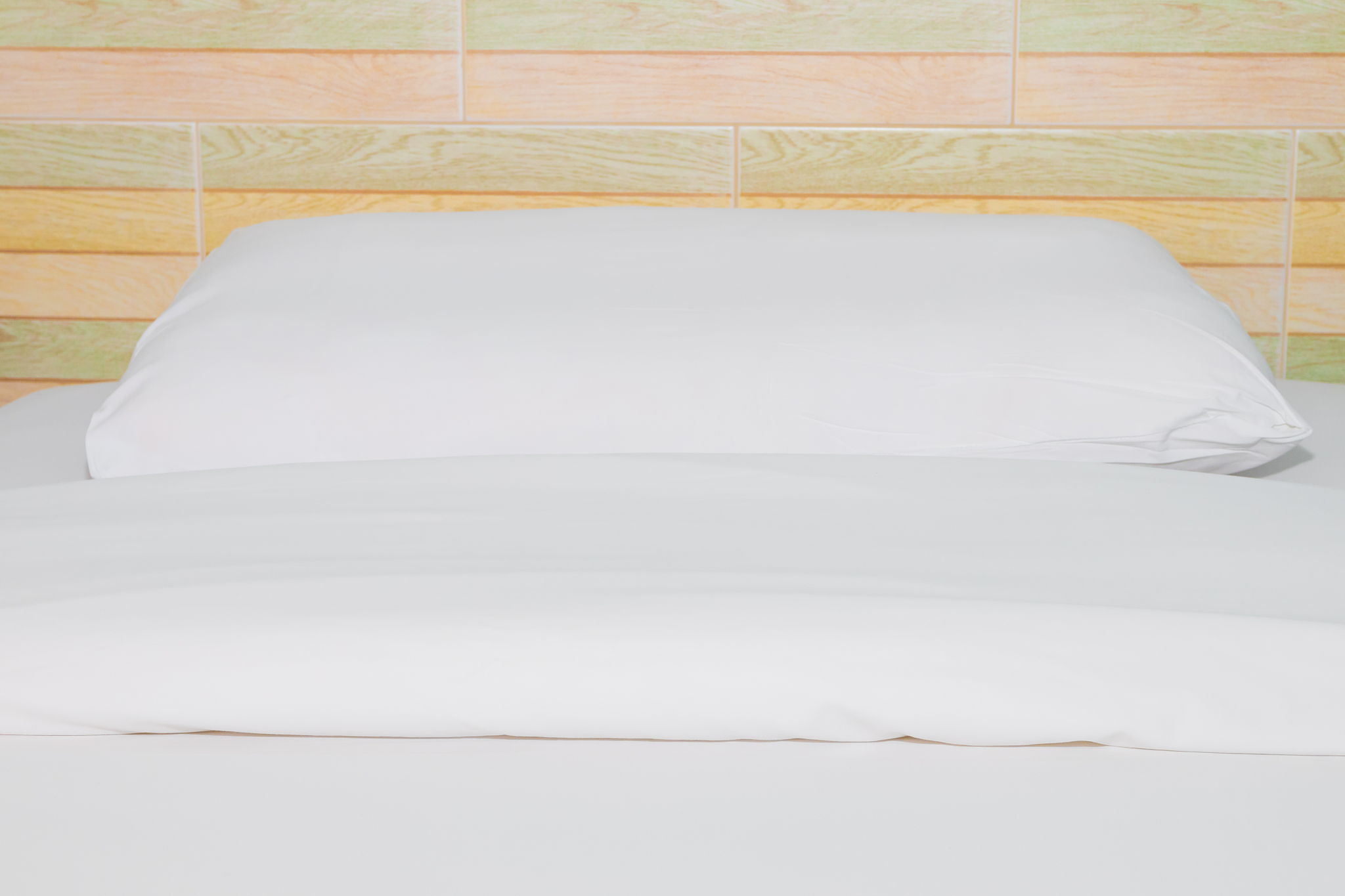 bed and  bedspread pillow white in in bedroom