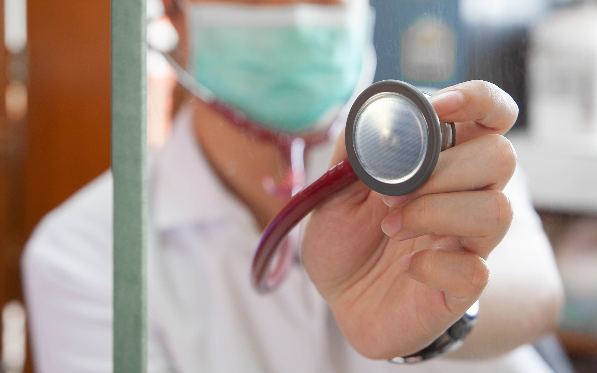 closeup of hand holding stethoscope. doctor holding stethoscope 