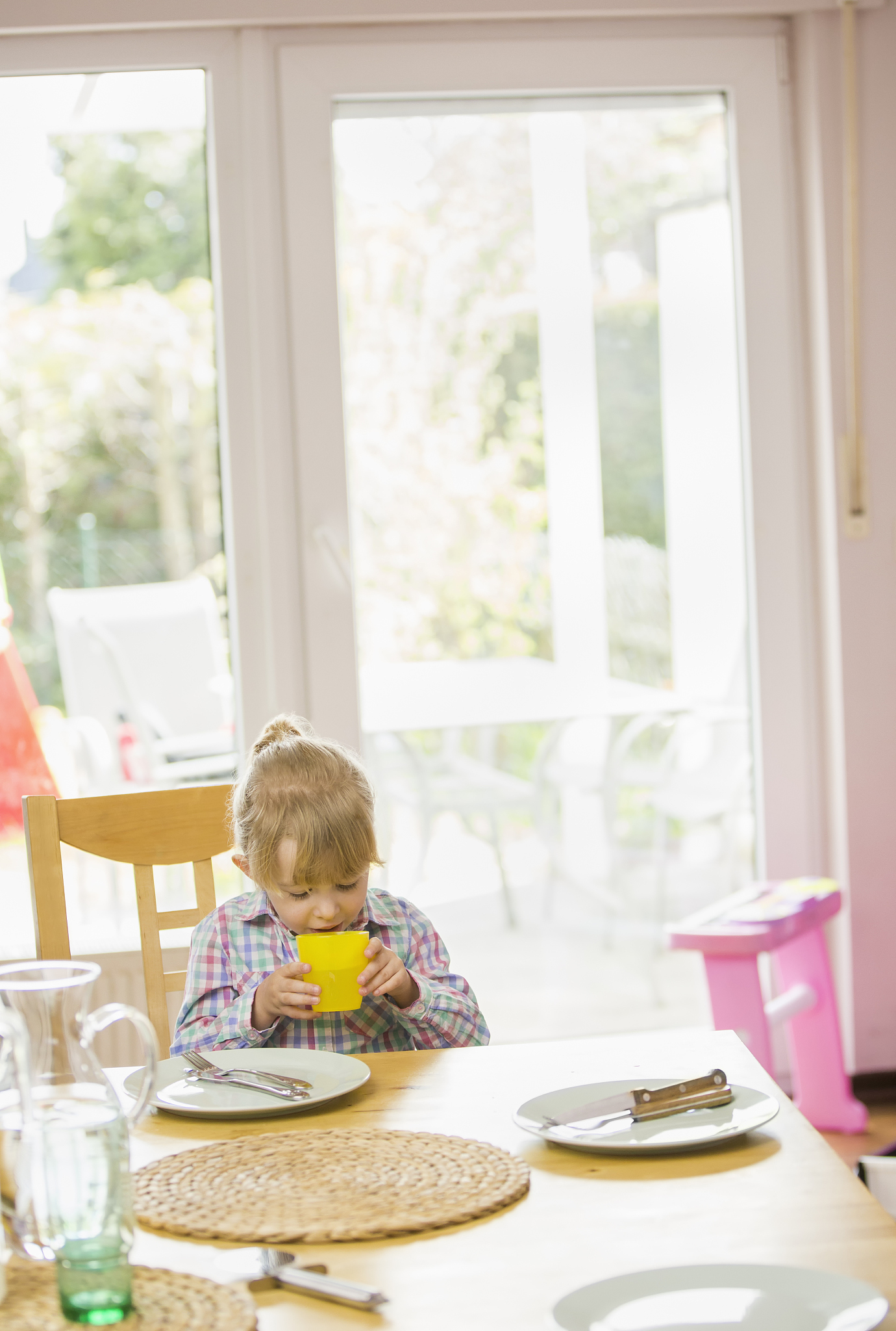family eating pizza at home out of pizza box