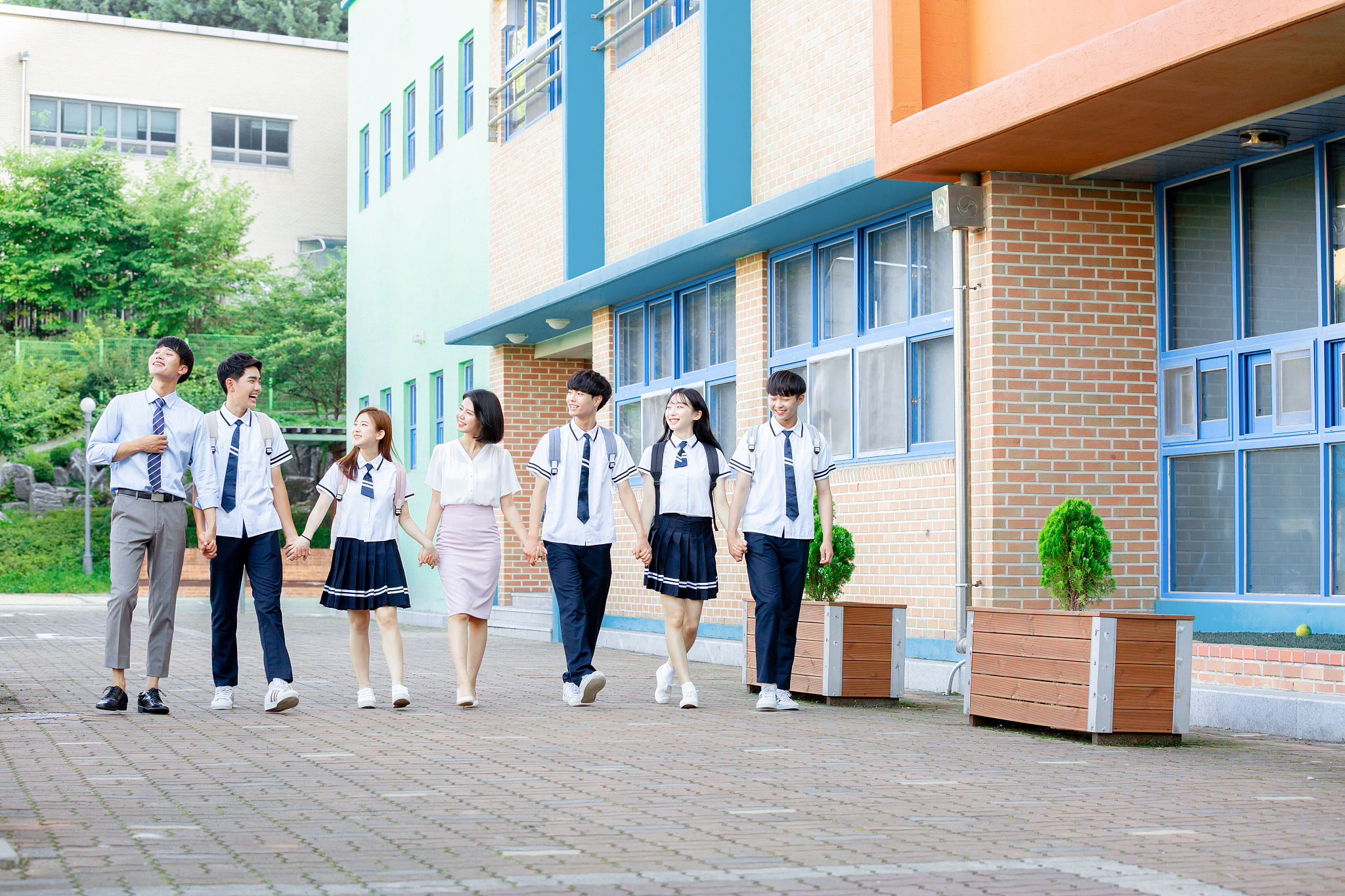 students and teachers going to school together