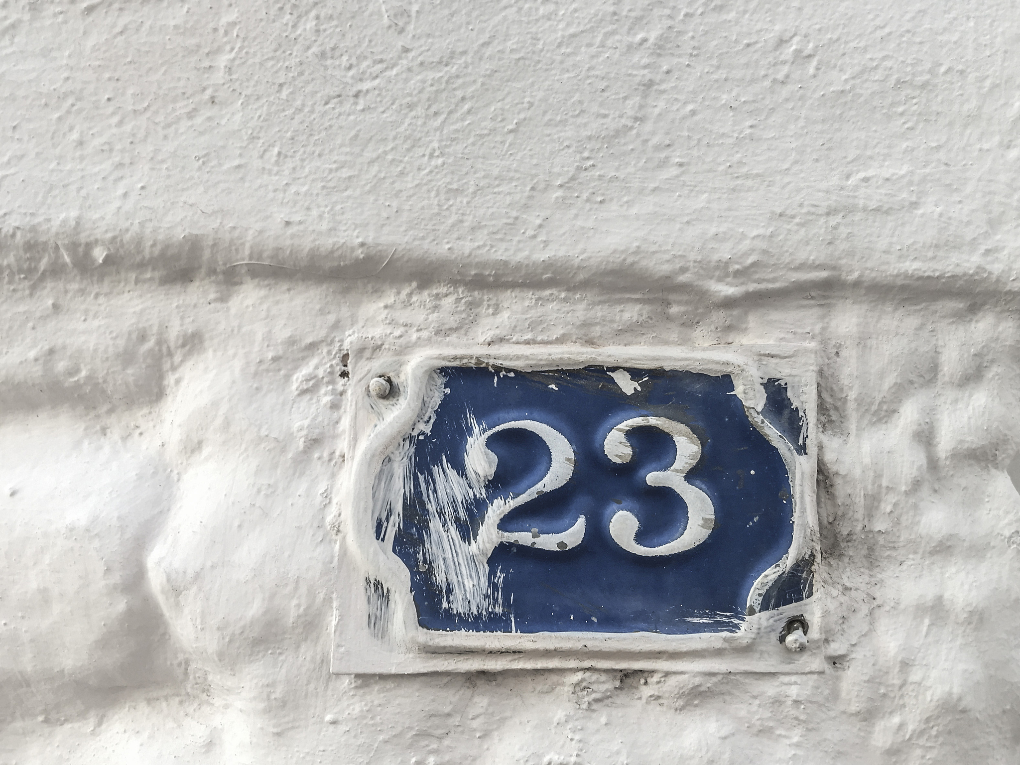 twenty three door number on wall of a building
