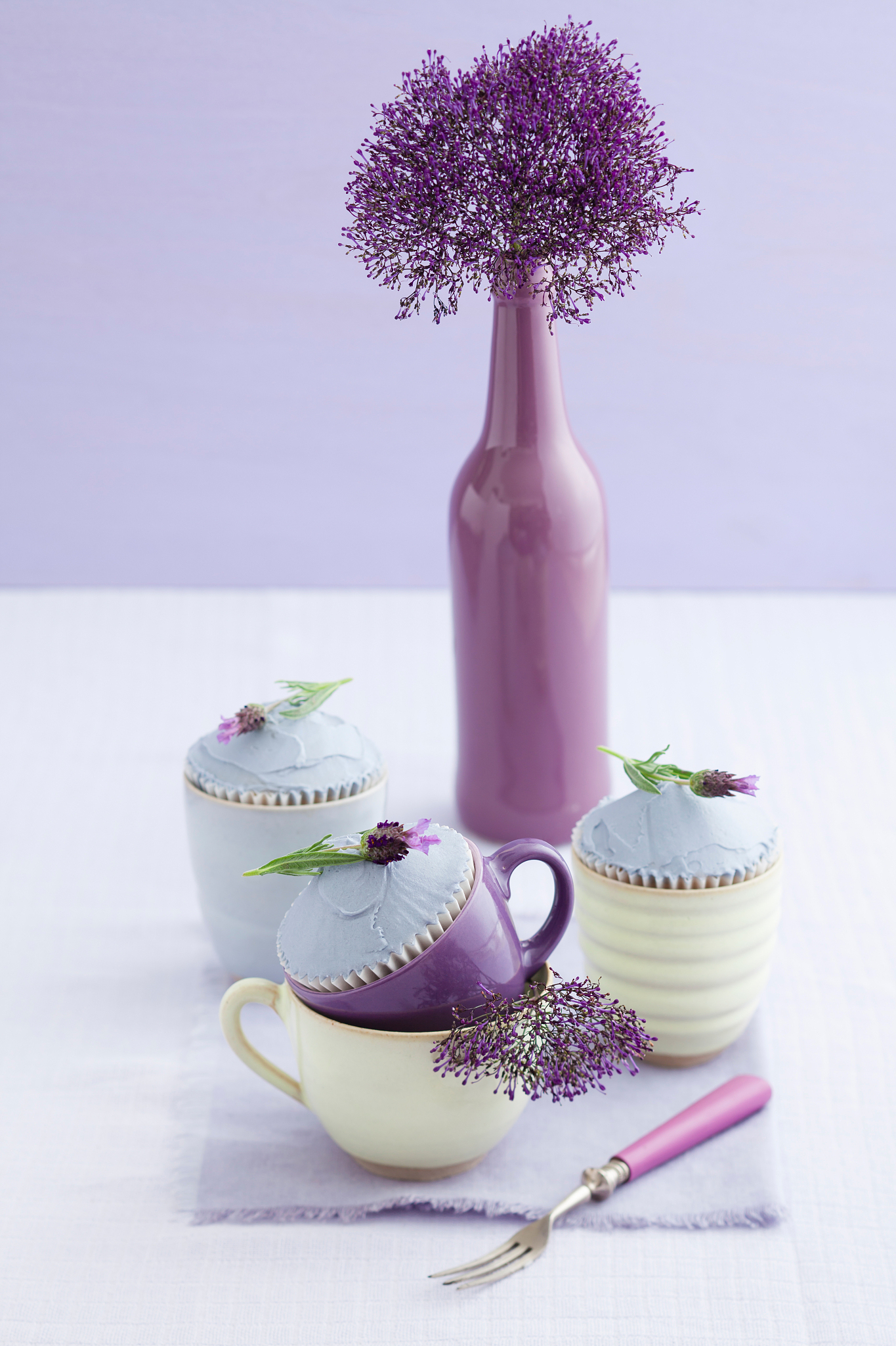 three lavender cupcakes