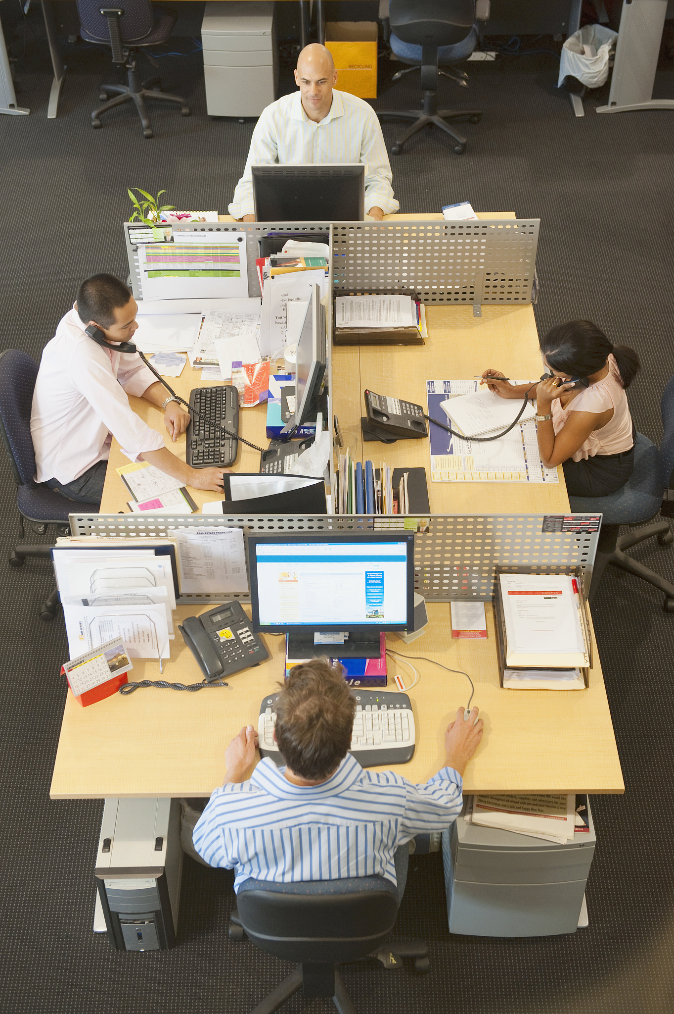 high angle view of business people working at desks in office