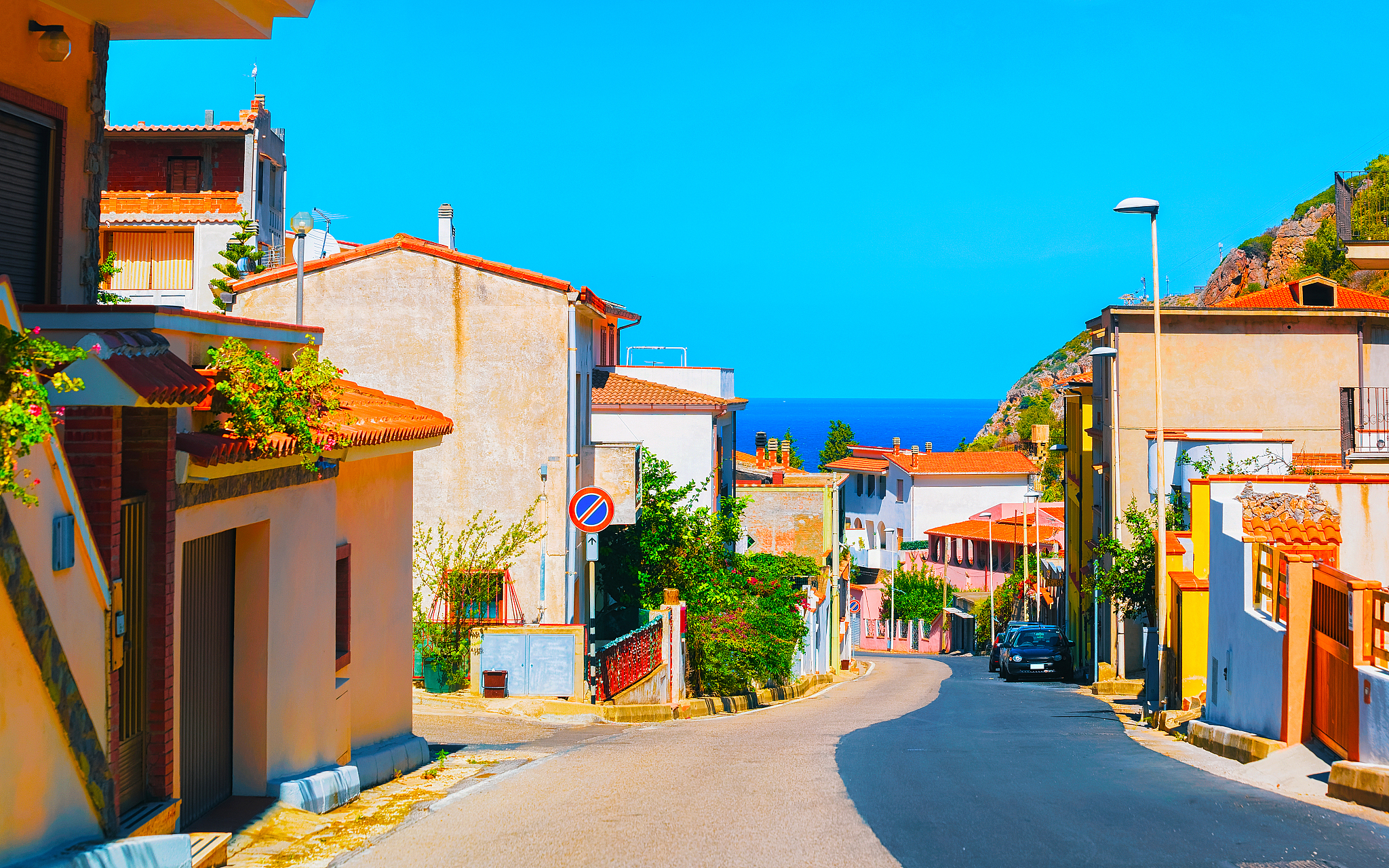 street in buggerru city with view on mediterranean sea south sar