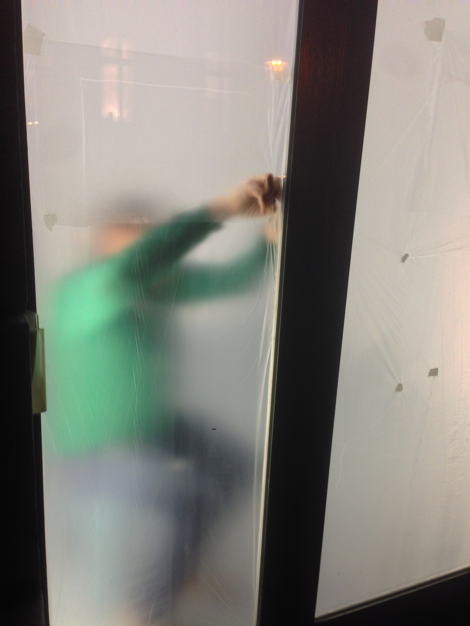 person seen through window