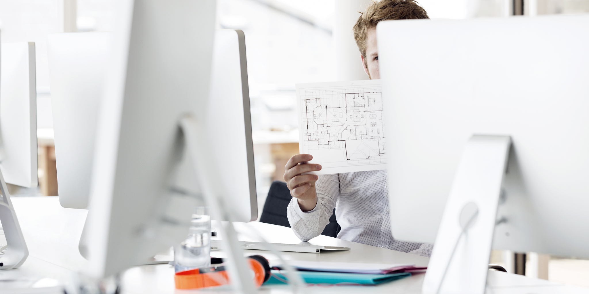 businessman reviewing paperwork in modern office