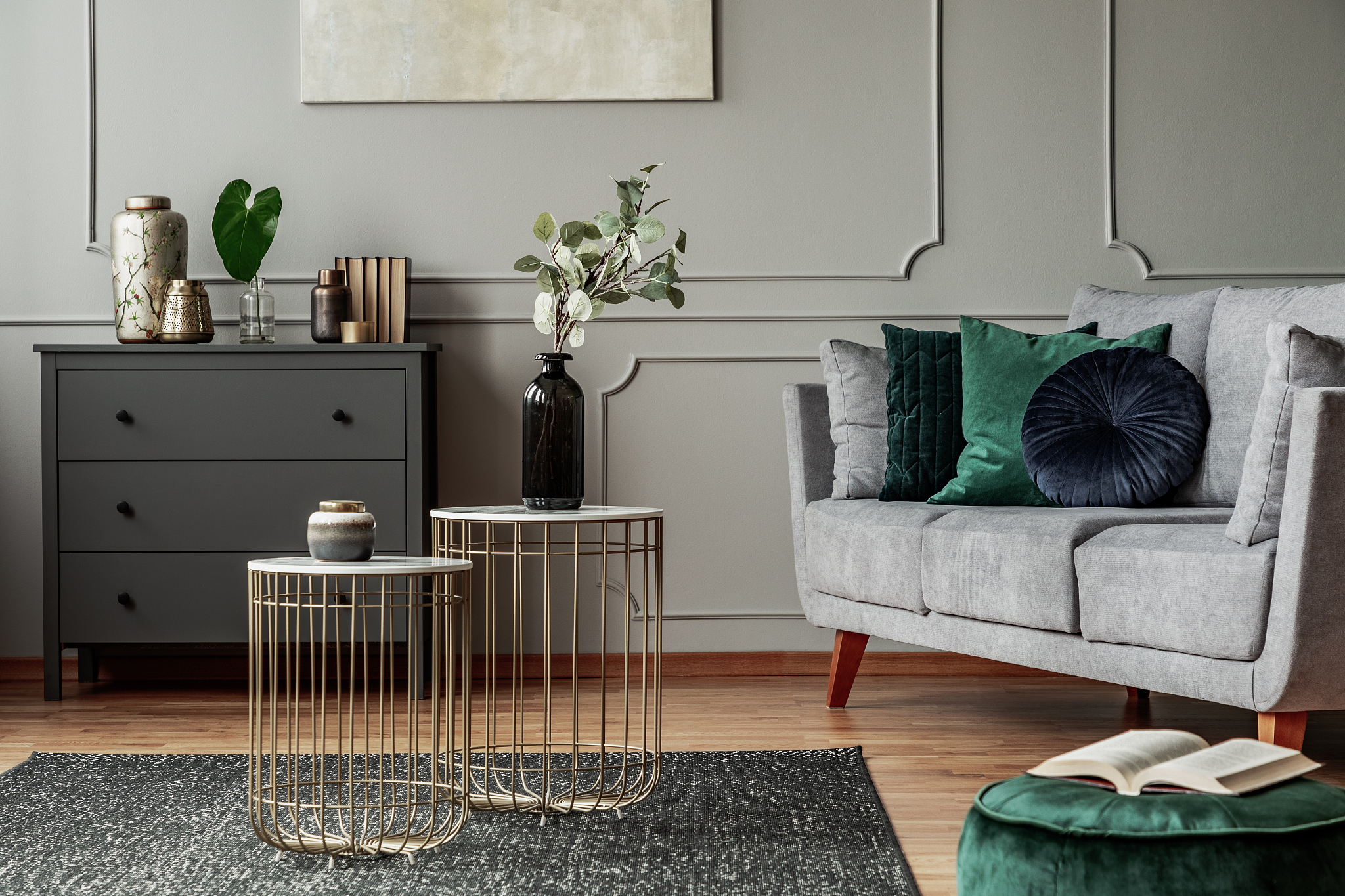 two stylish small coffee tables with marble tops in front of ele